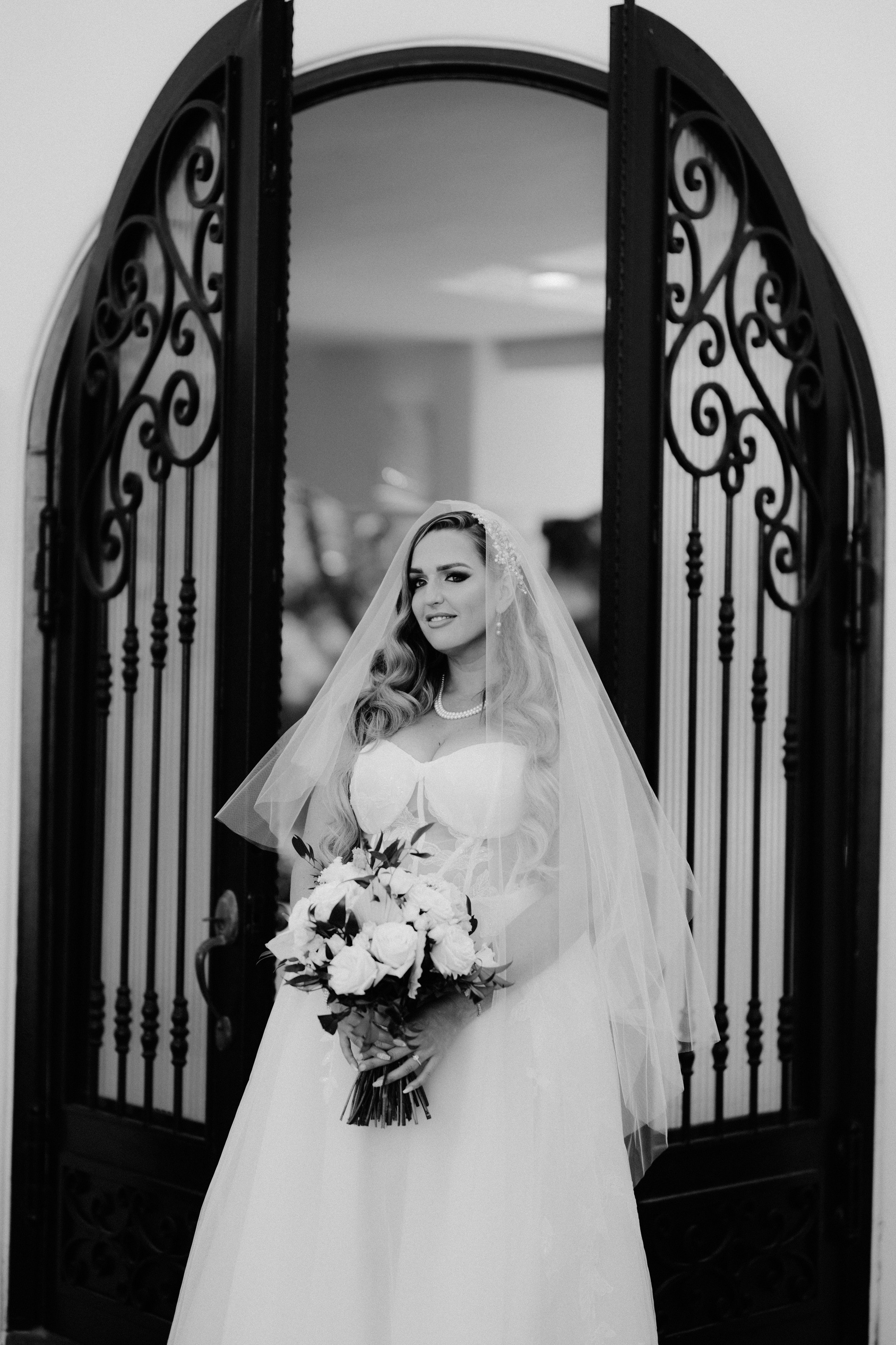 a bride standing in front of a mirror