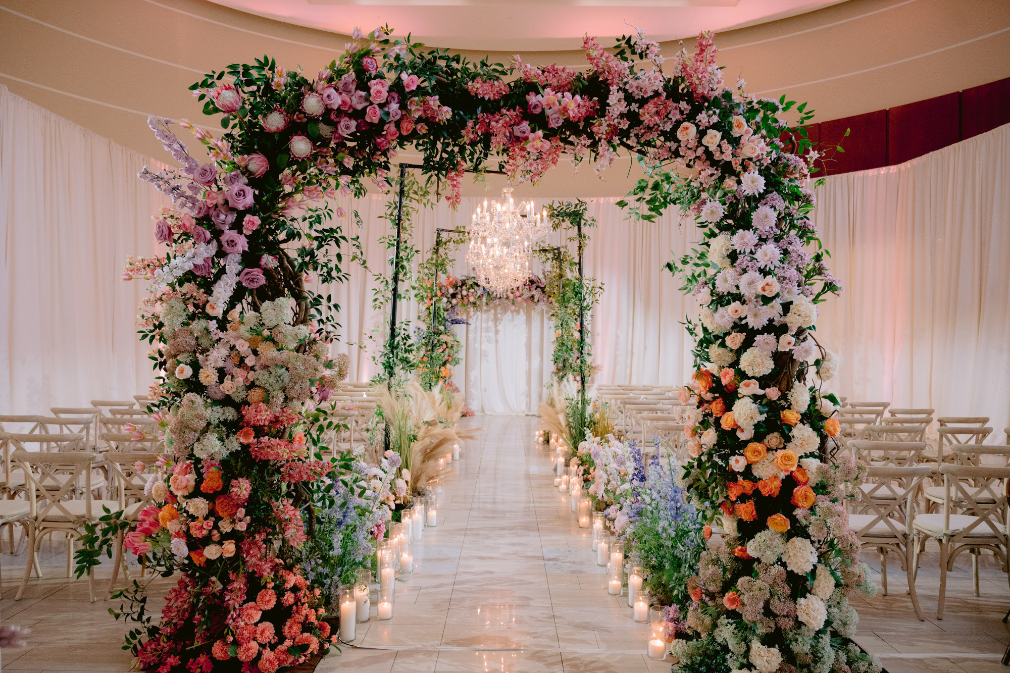 a wedding ceremony with flowers and candles