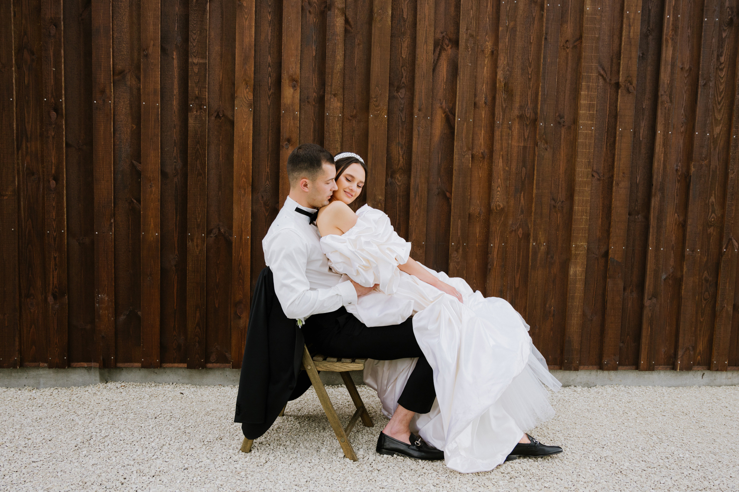 a man and woman sitting on a bench