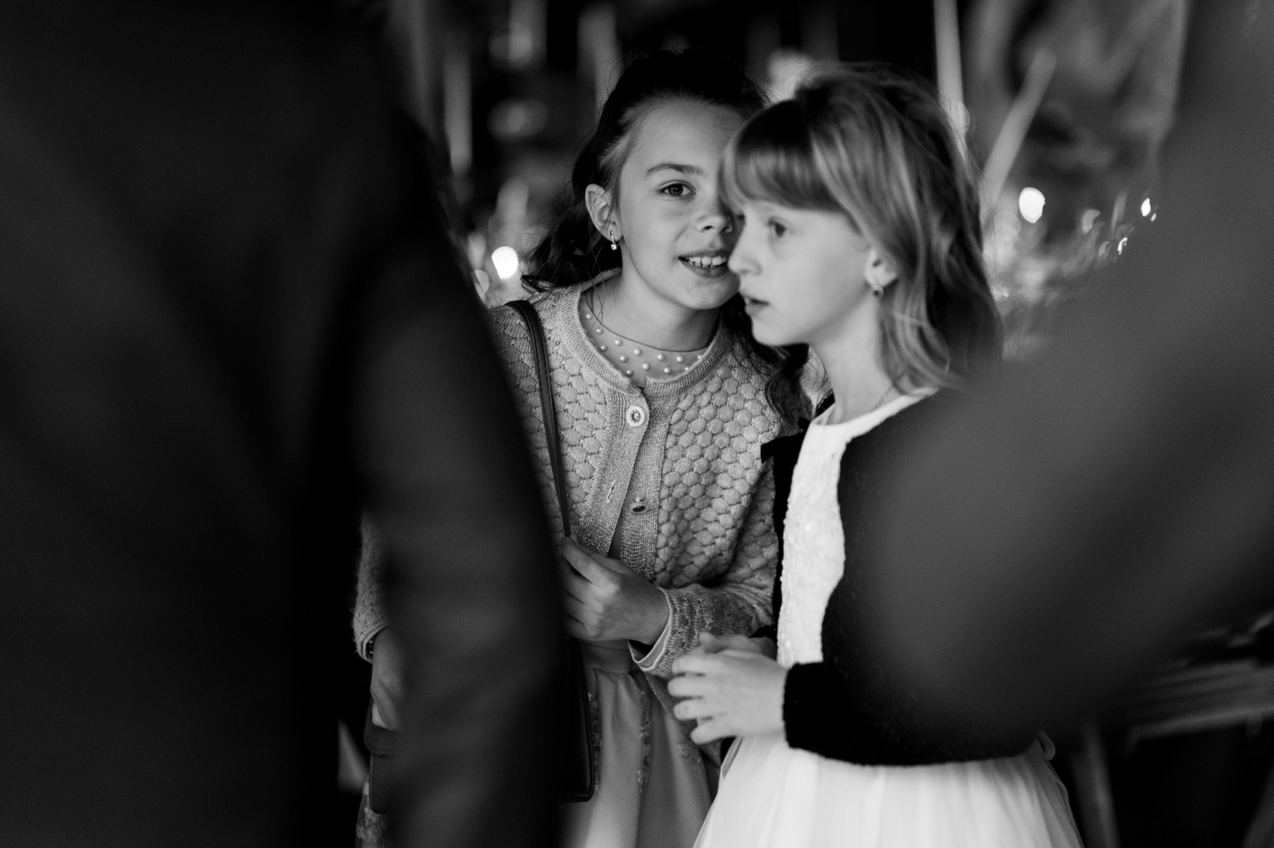 a little girl is hugging her mother