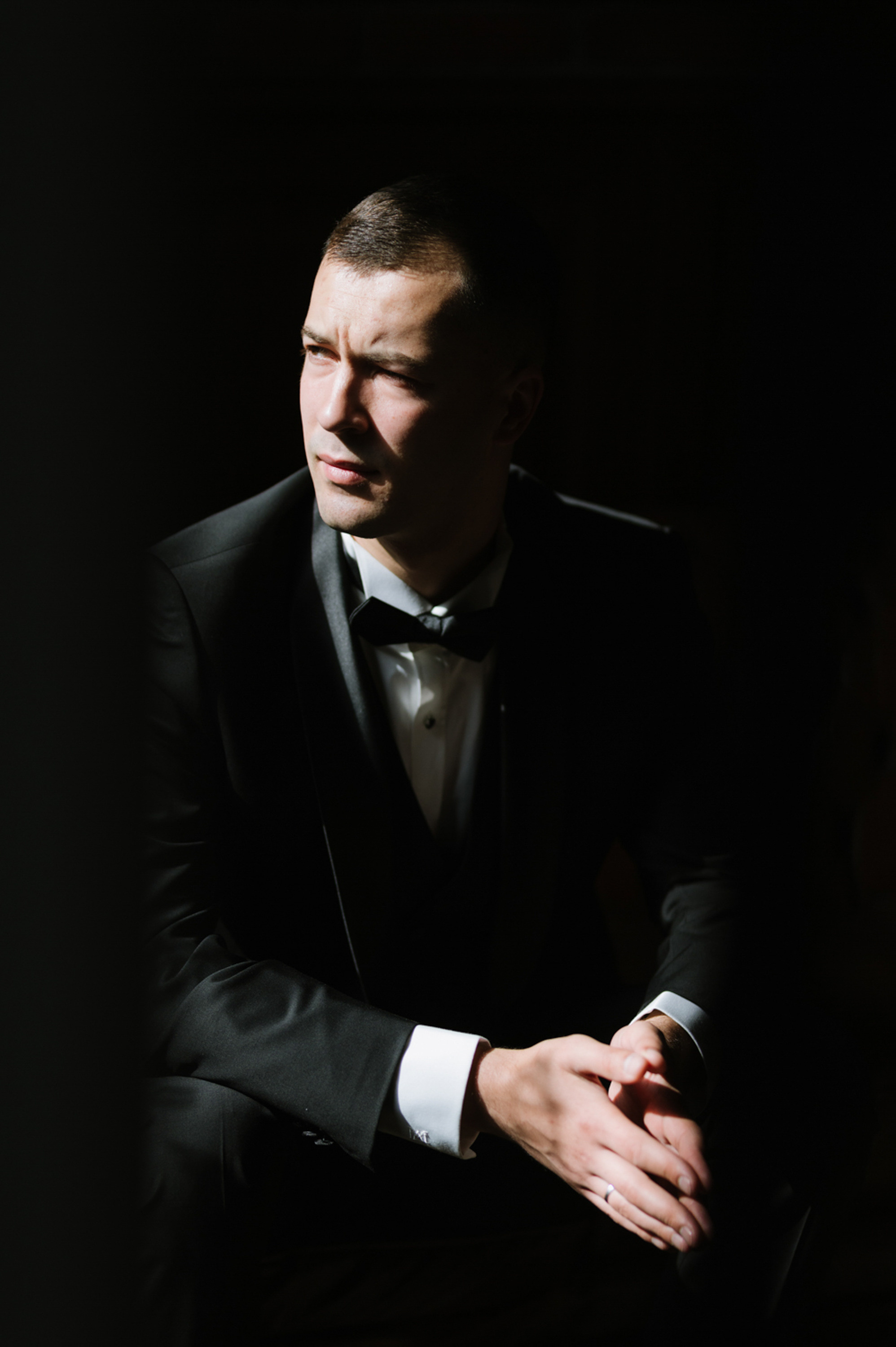 a man in a tuxed suit and bow tie