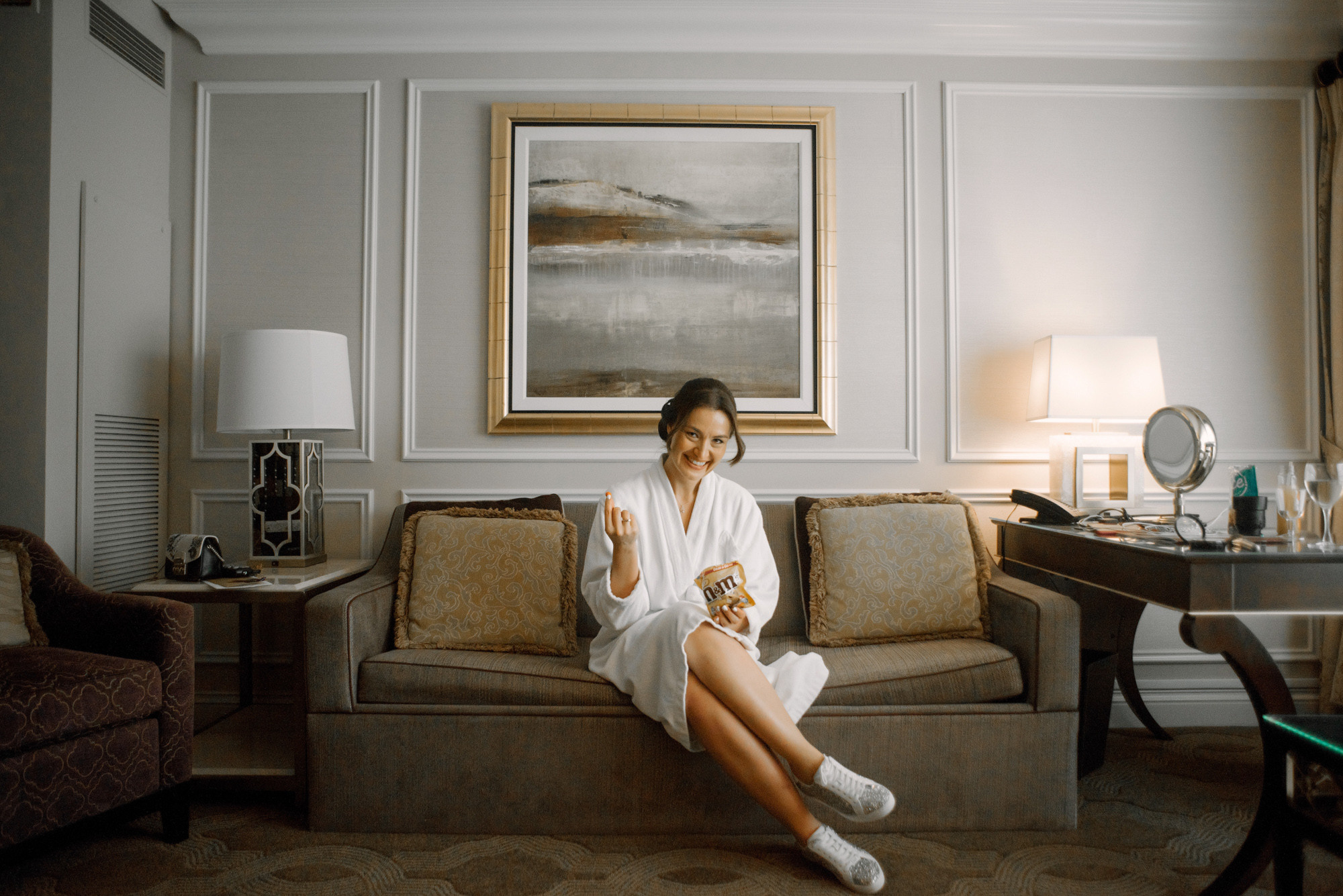 a woman sitting on a couch in a living room