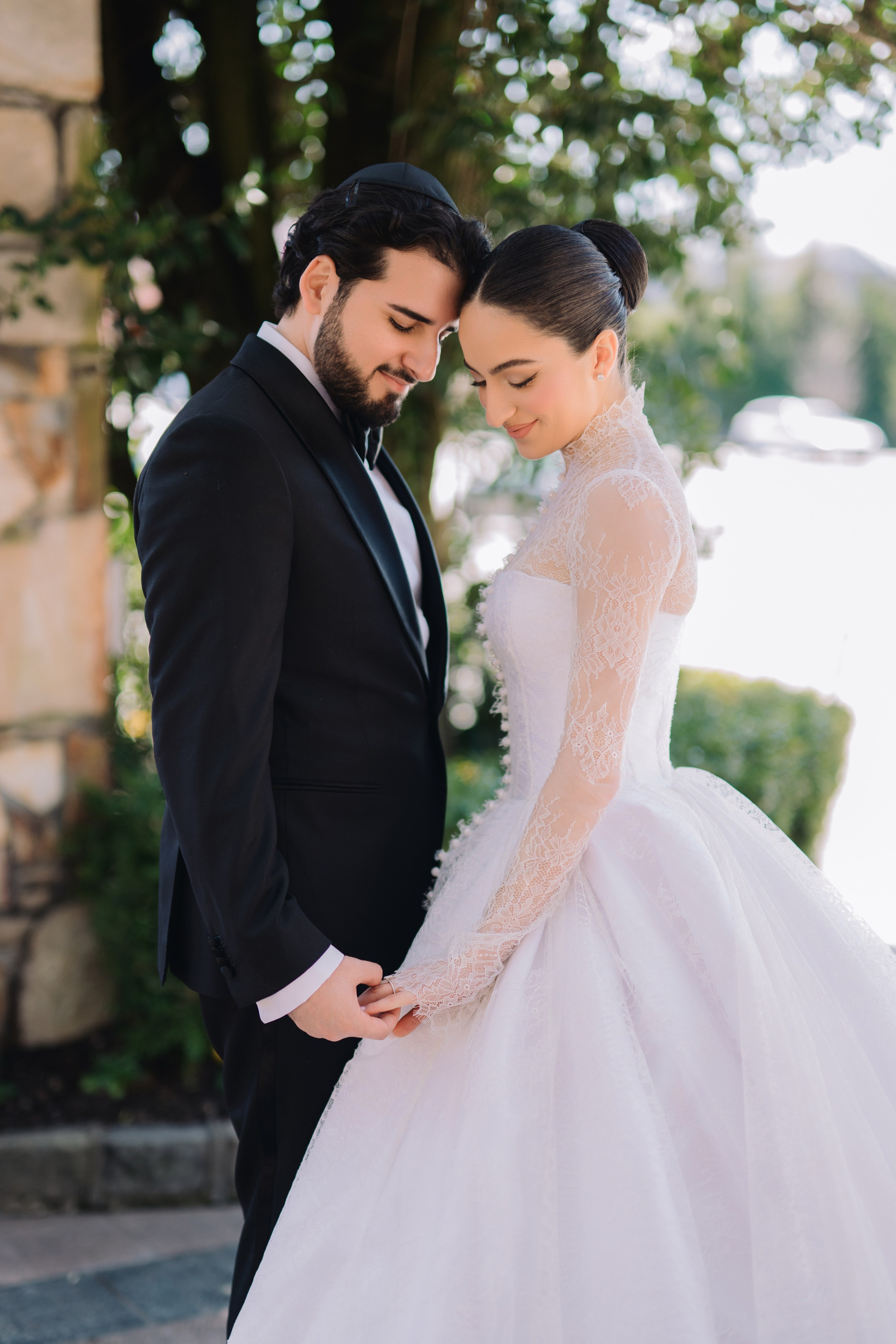 a bride and groom pose for a photo