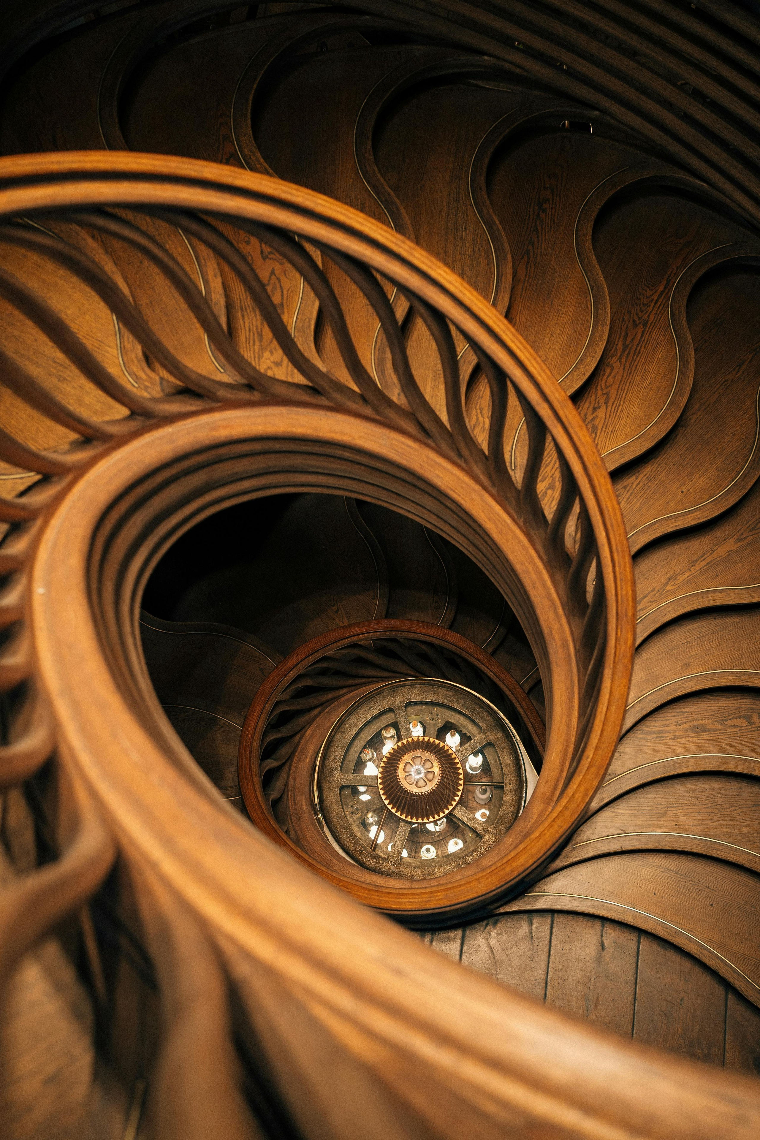 Architectural photography of spiral staircase with cinematic lighting and symmetry, photographed by Jay Soundo Creative.