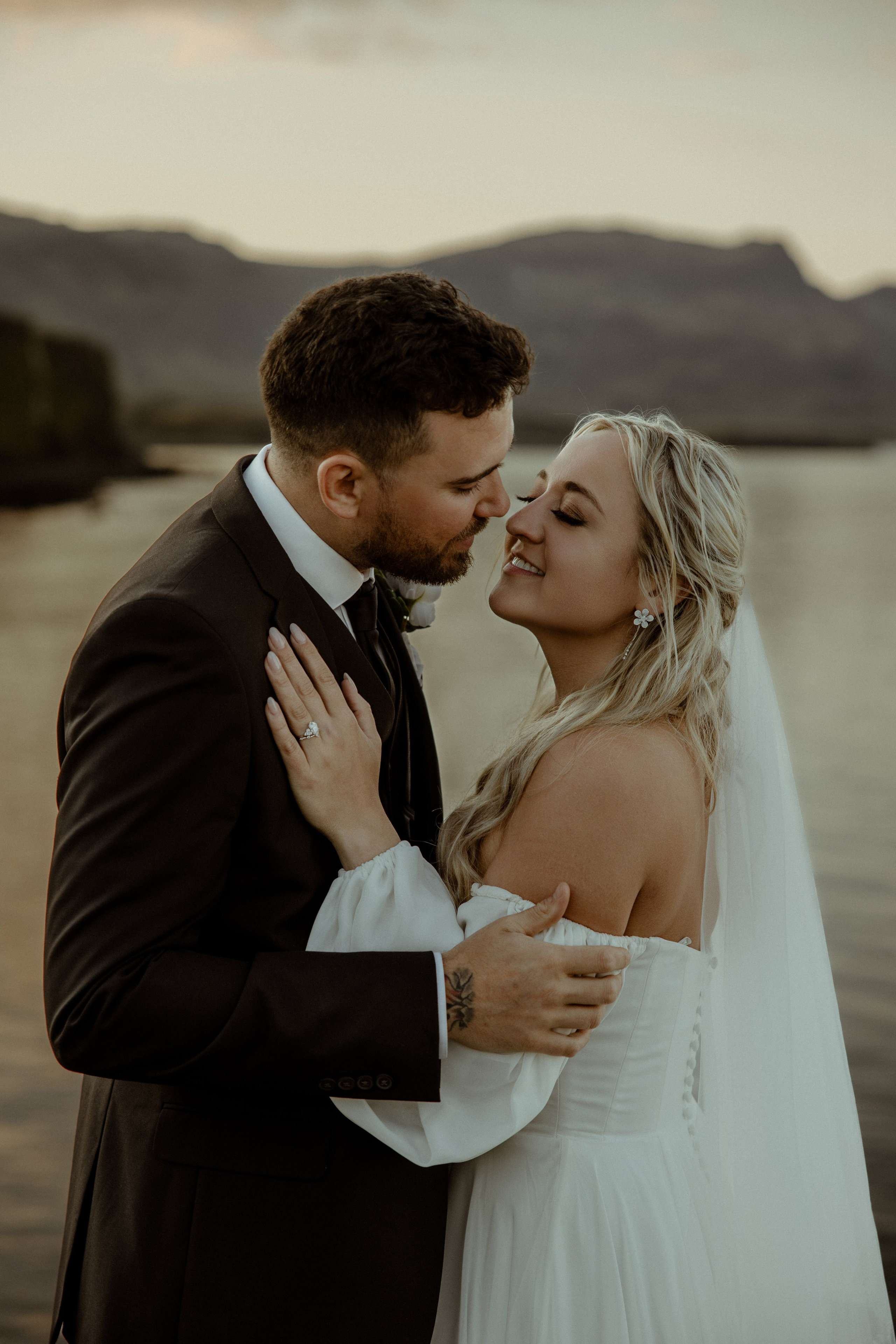 Iceland elopement at Budir with midnight sun wedding photos at black sand beach. Iceland elopement photographer & videographer