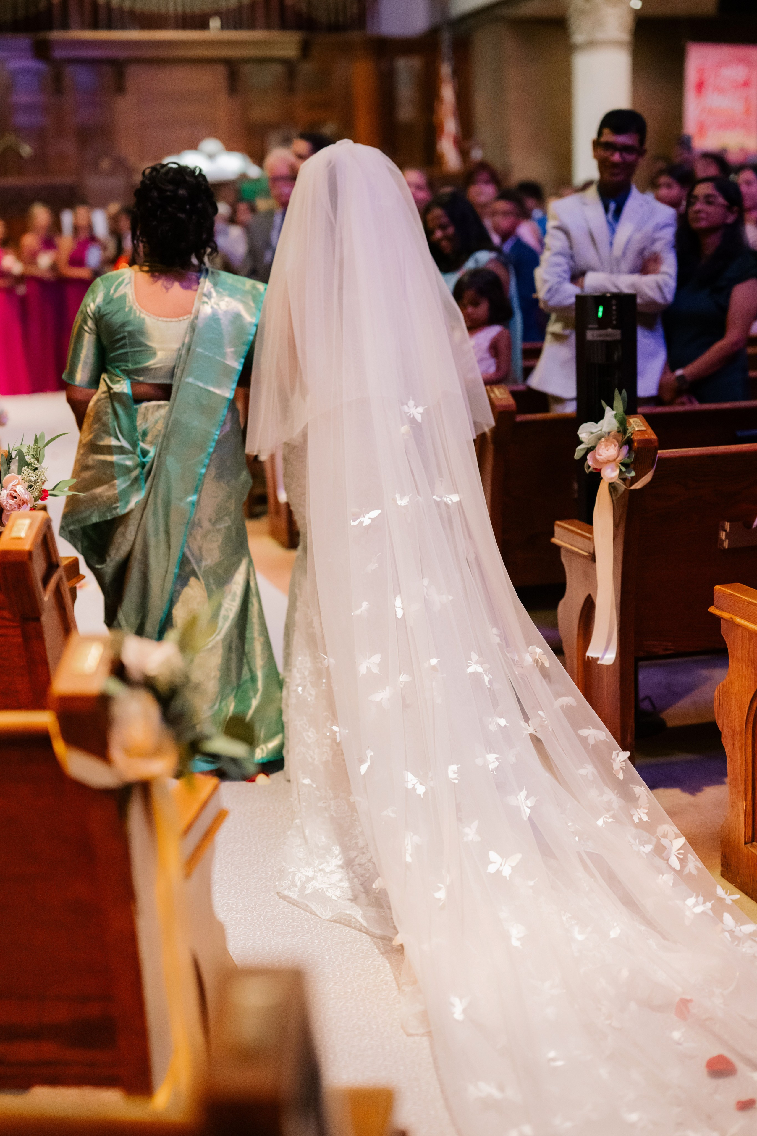 a bride walking down the aisle of a church
