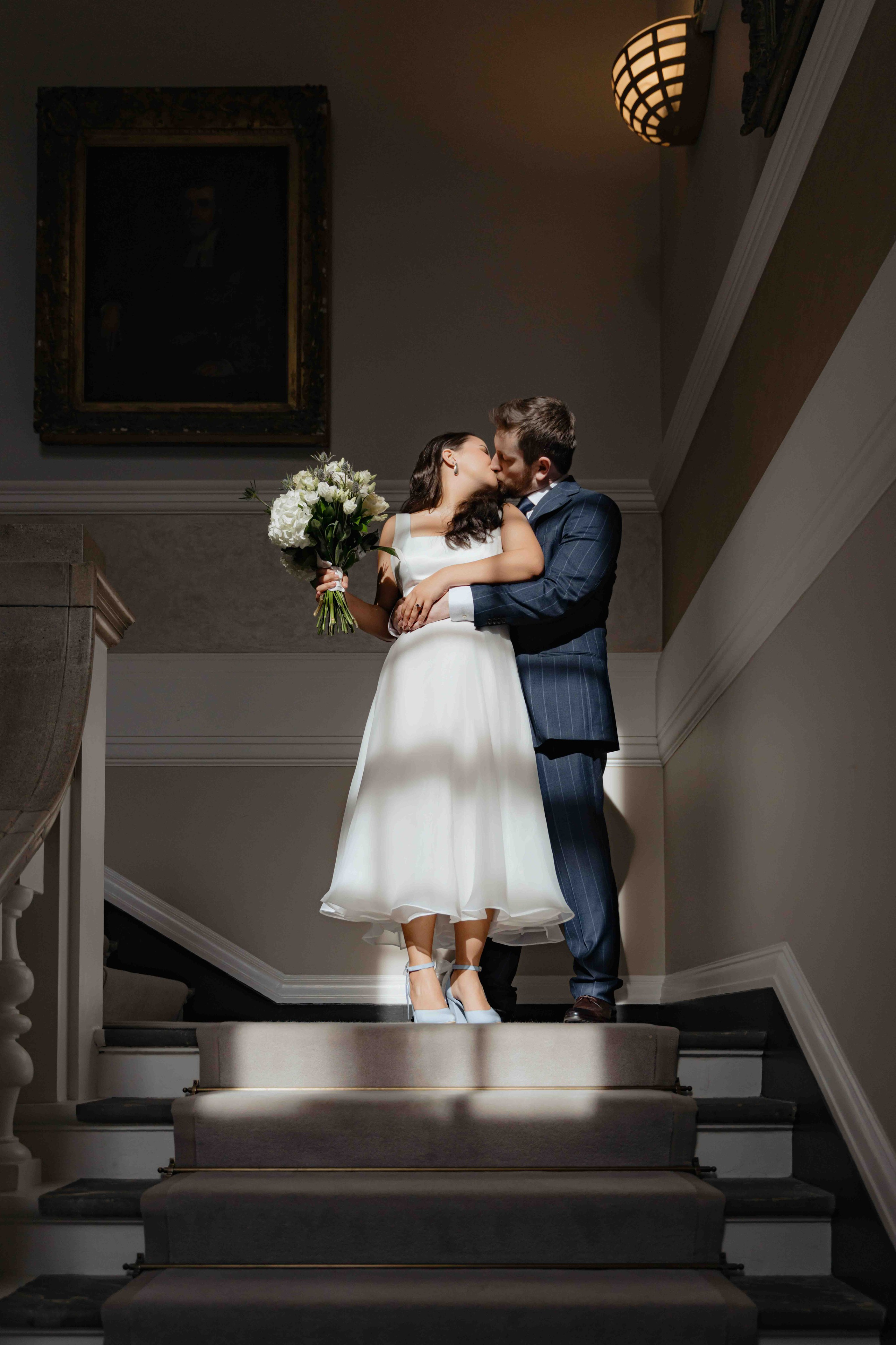 Bride and groom during civil ceremony at Chelsea Town Hall, London wedding photographer, elegant and documentary style