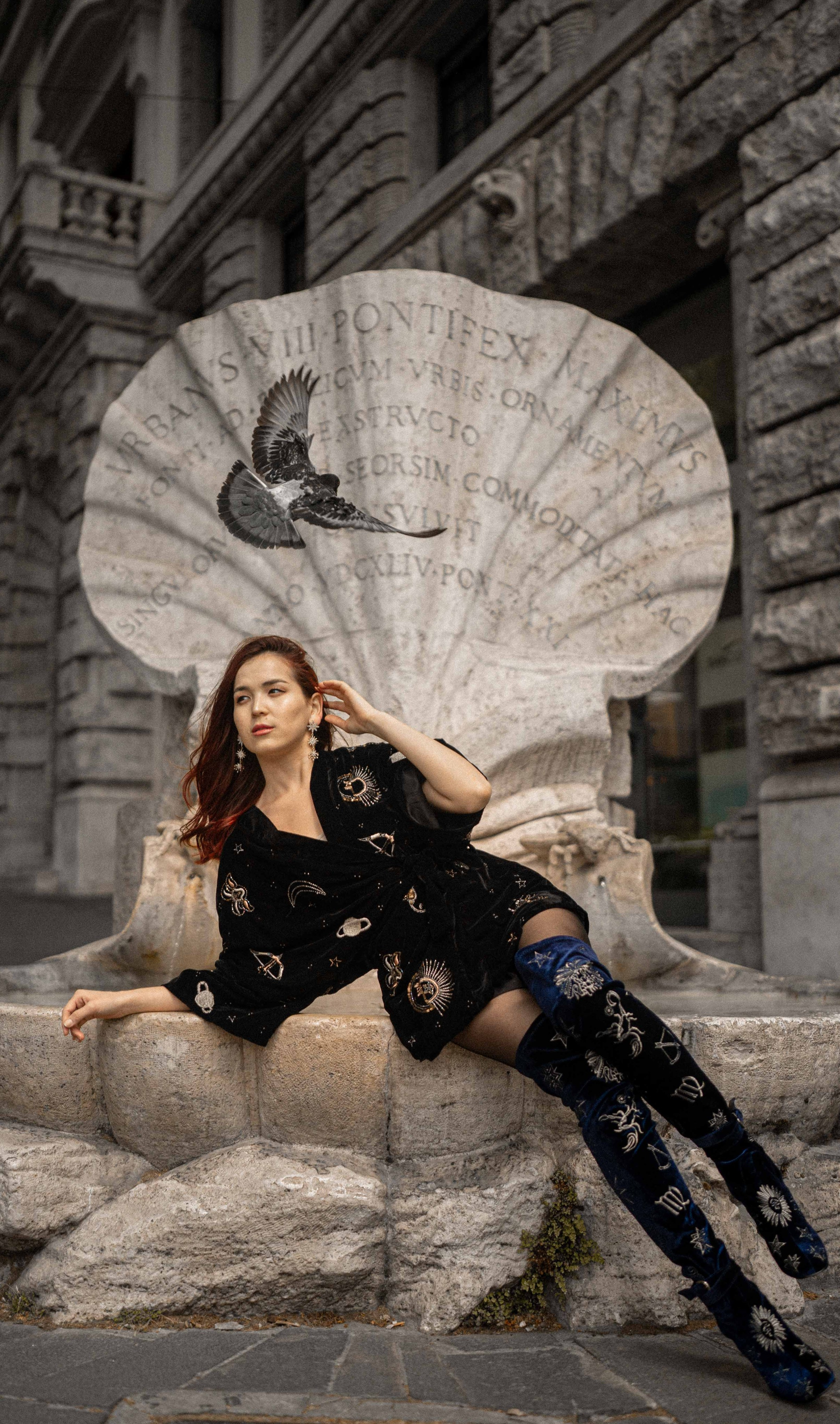 Girl at an old shell fountain — best photo spots in Rome