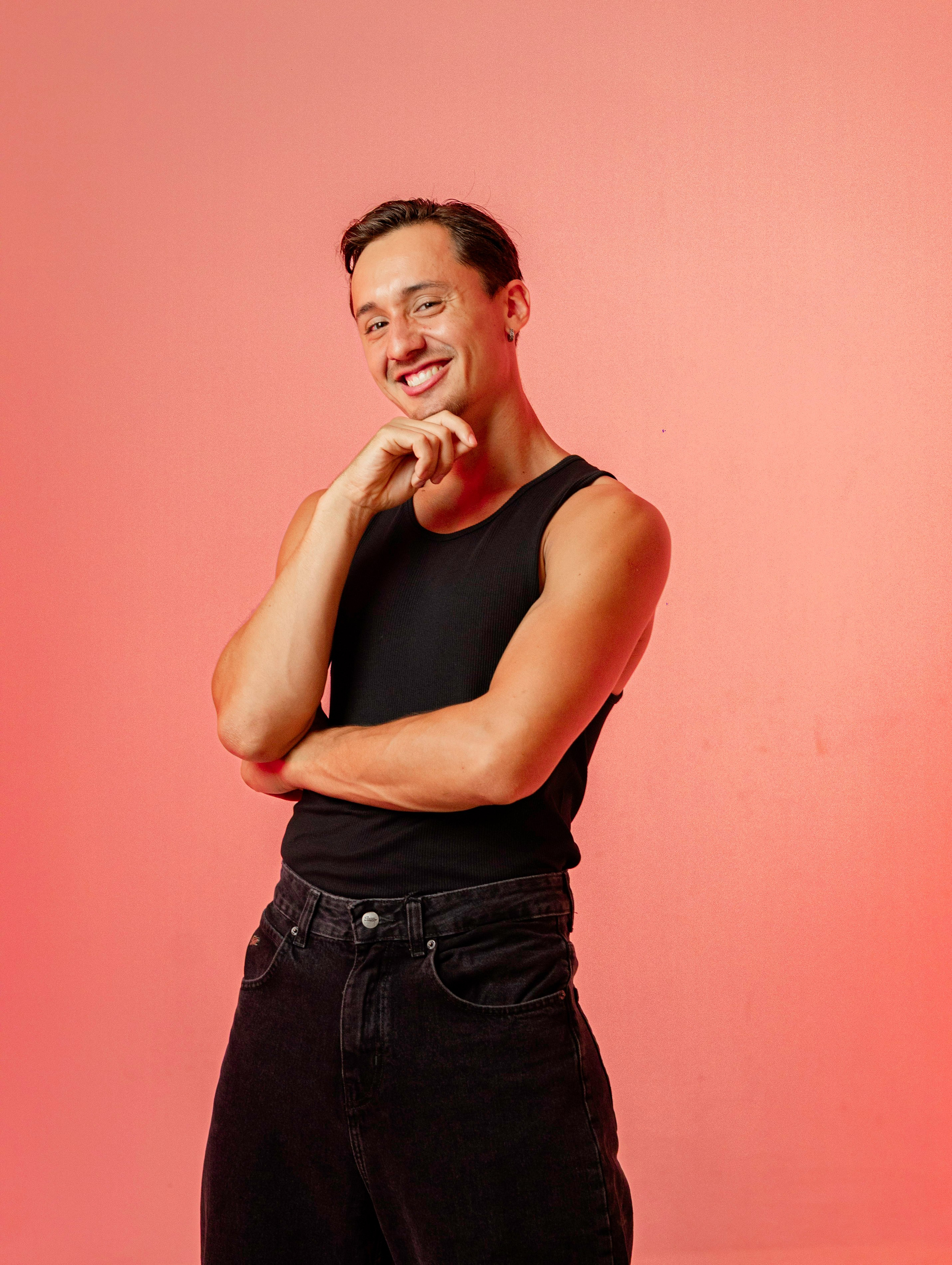 Male salsa instructor posing in a photography studio