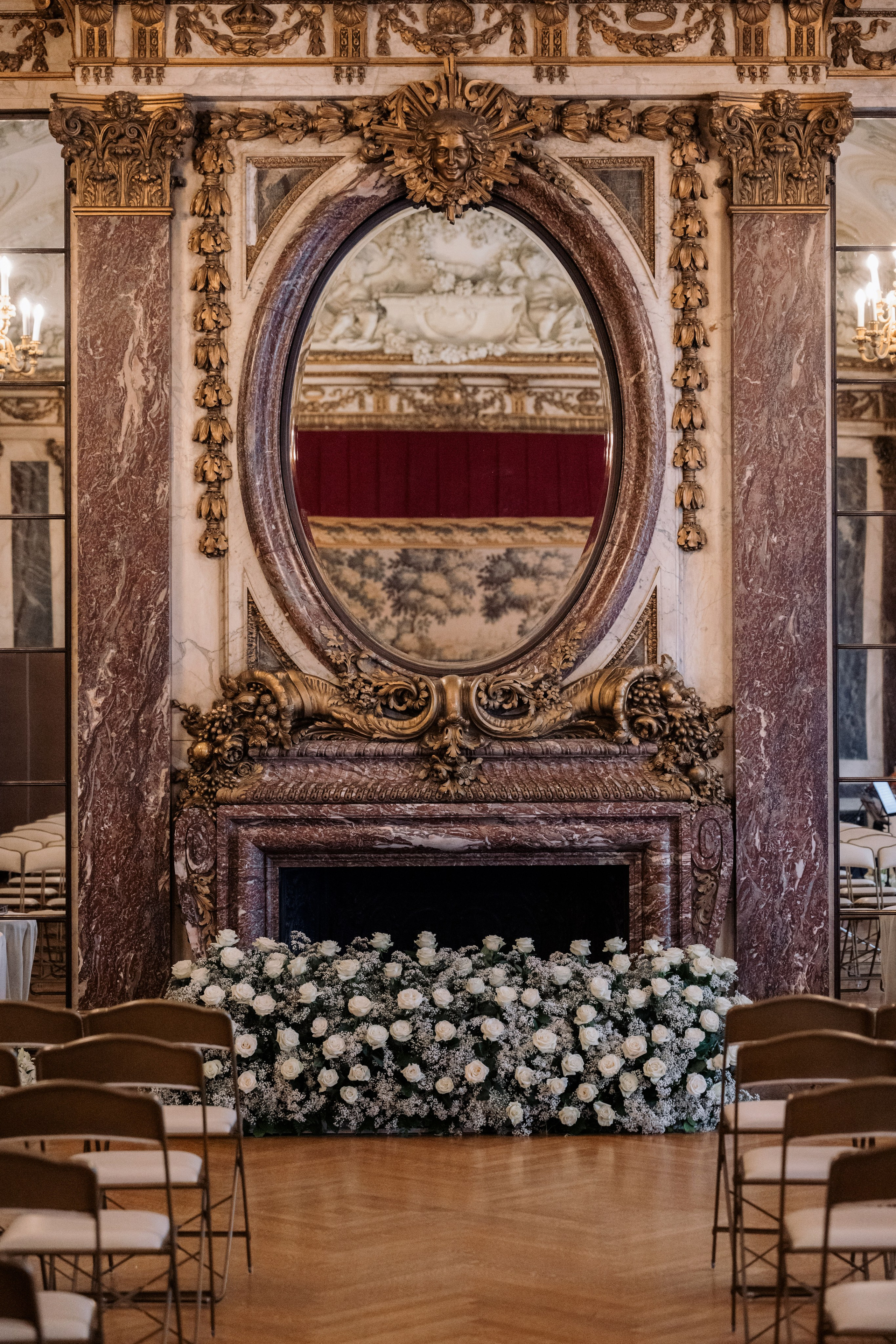 a fireplace with a mirror above it