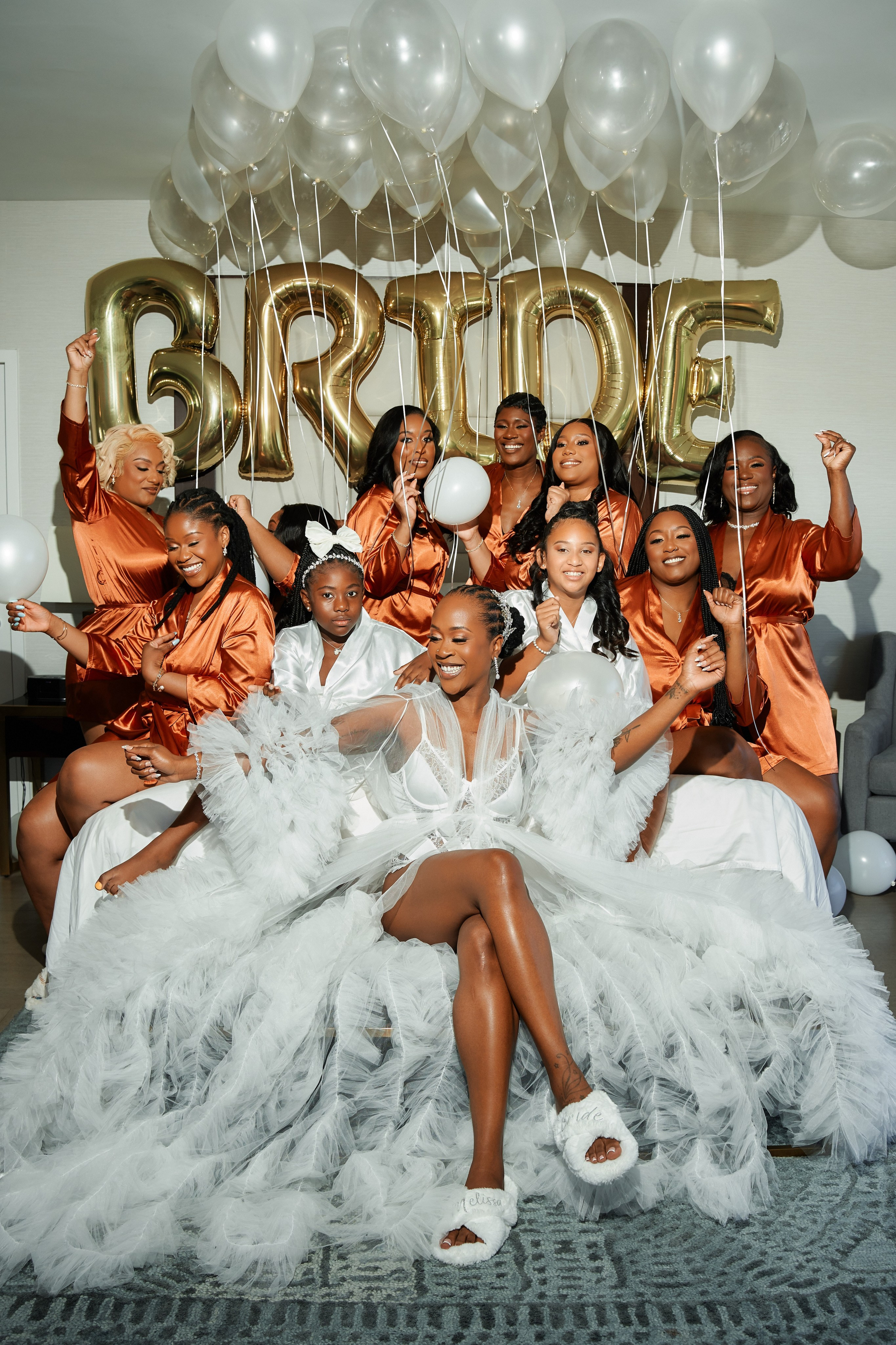 Fun bridal party photo with bridesmaids and balloons at luxury wedding in New Jersey