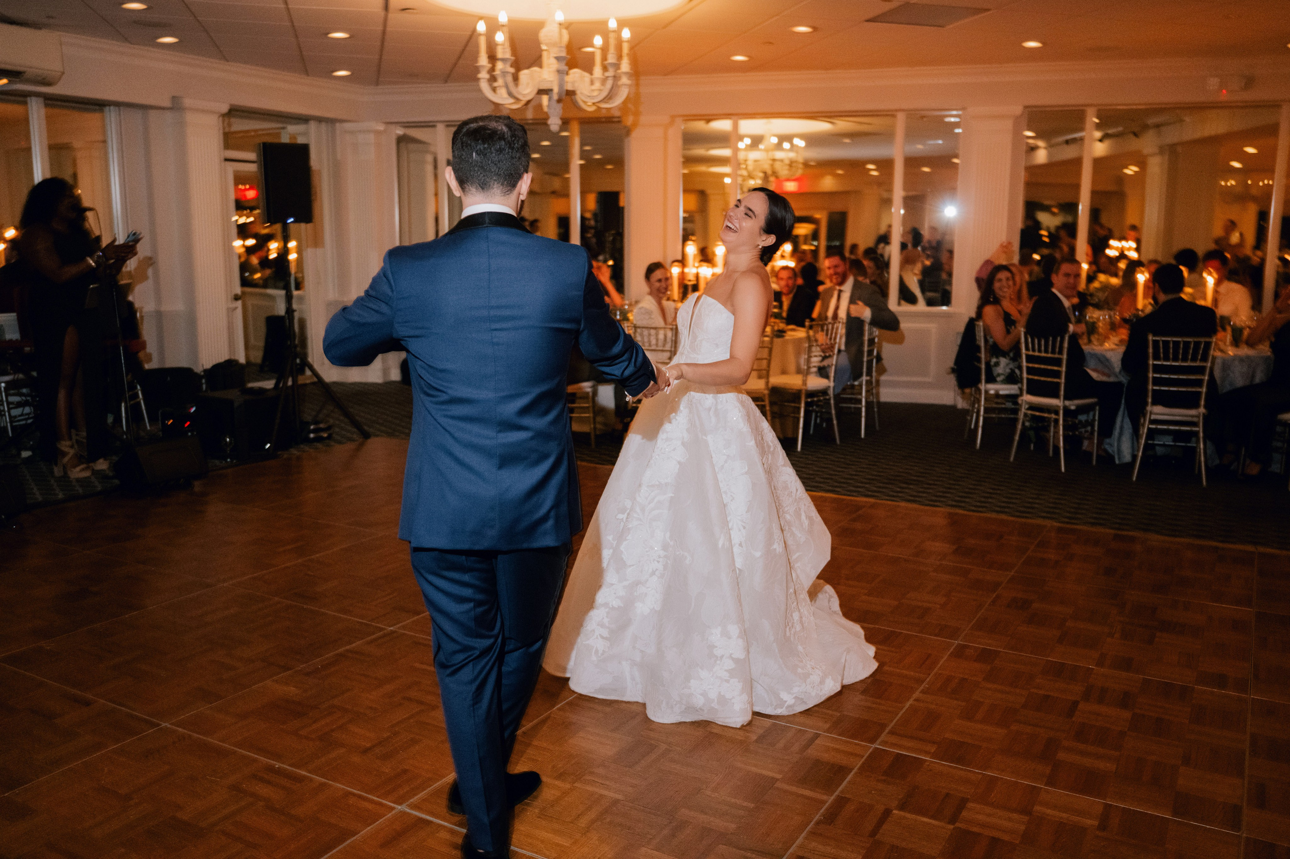 a bride and groom dancing at a wedding reception