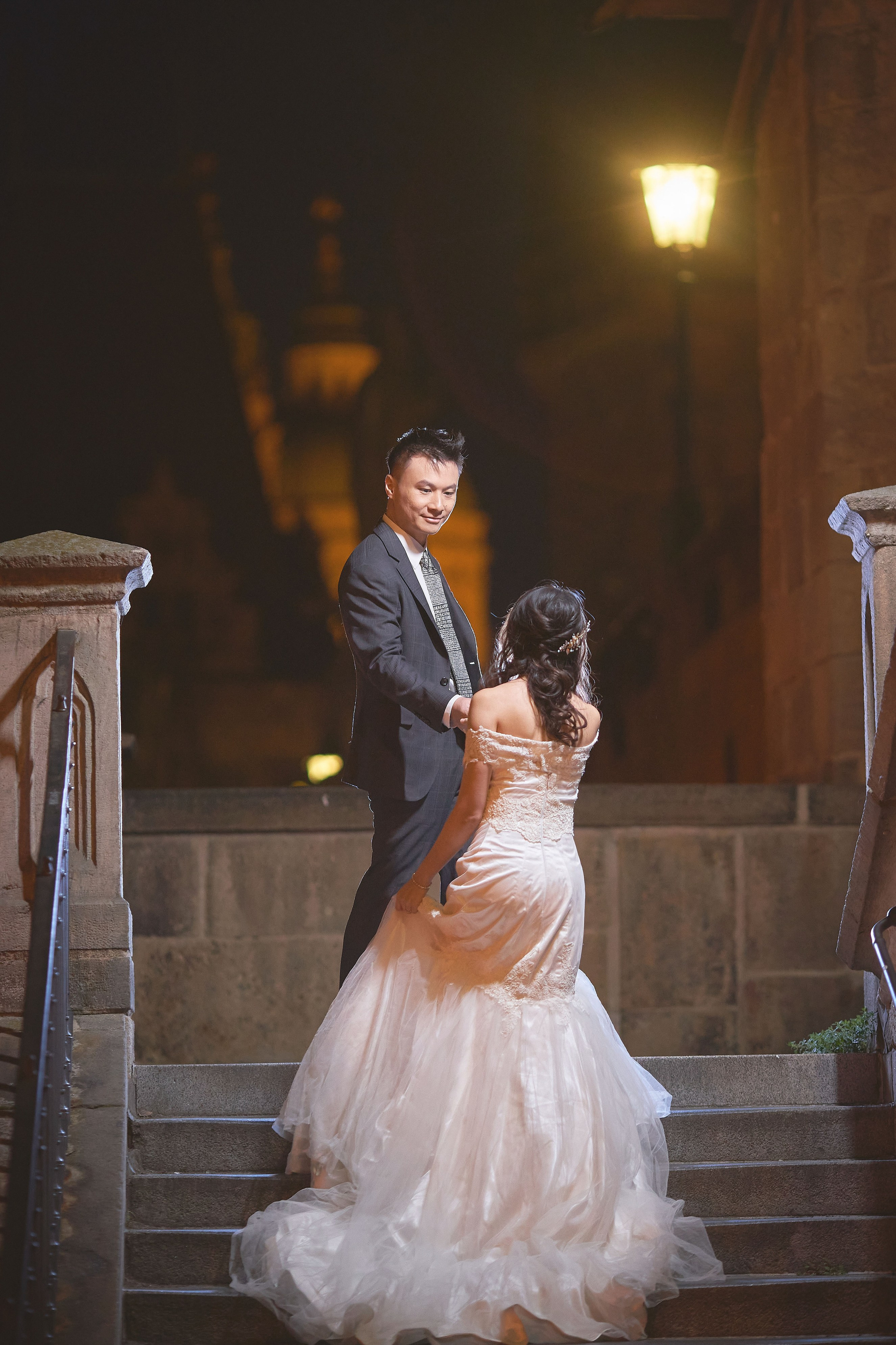 Eva and Conan walking up Kampa Steps in early morning silence, Charles Bridge area, Prague.