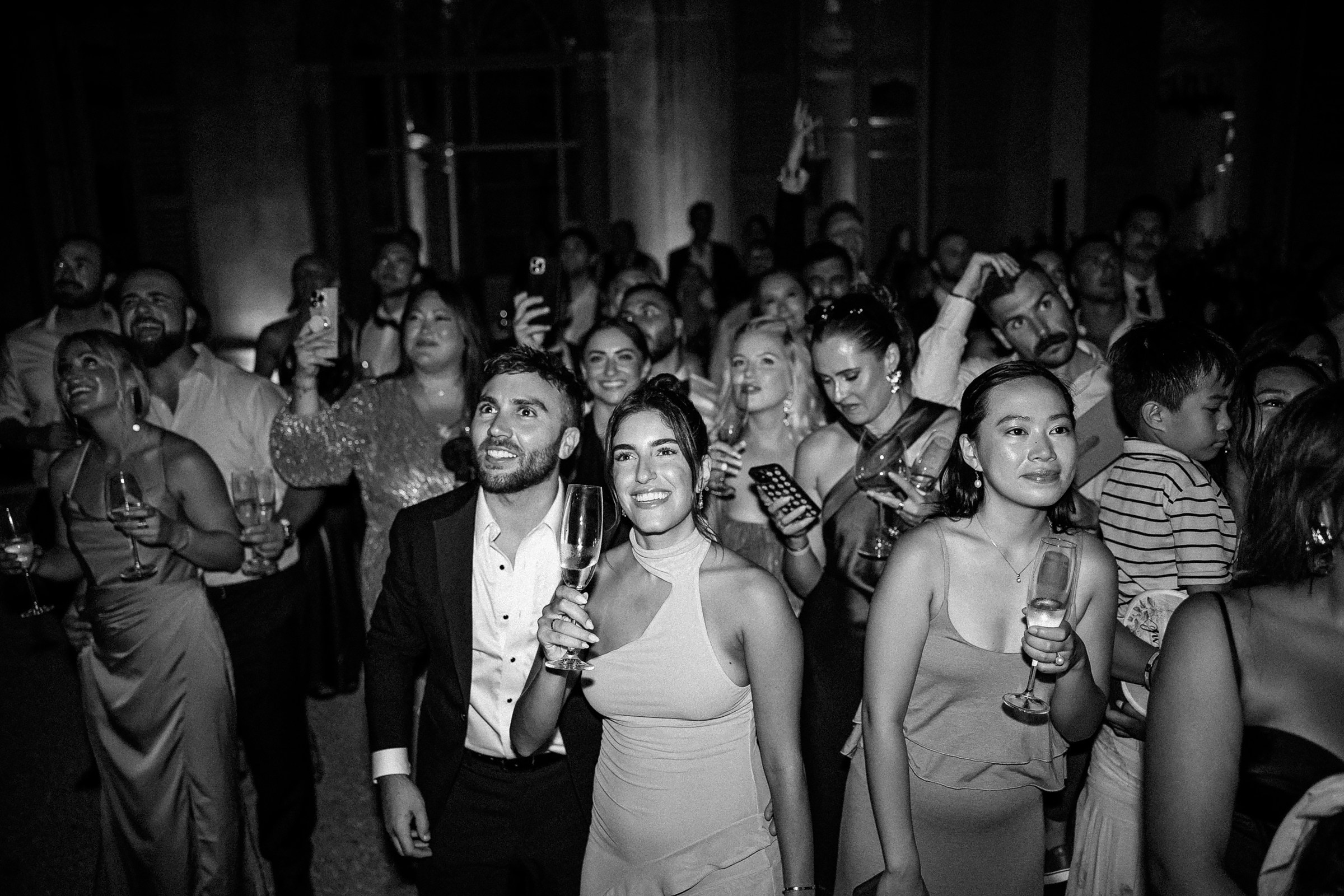 Guests captivated by fireworks, capturing the joyous energy of the celebration.