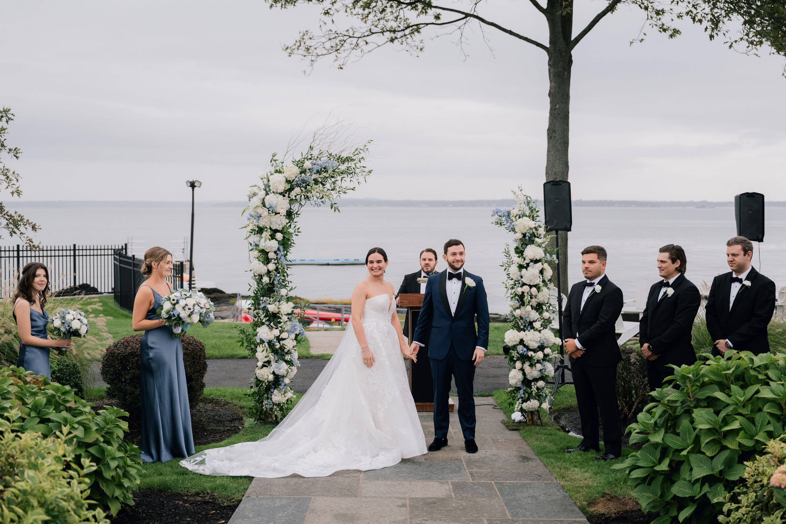 a bride and groom walking down the aisle