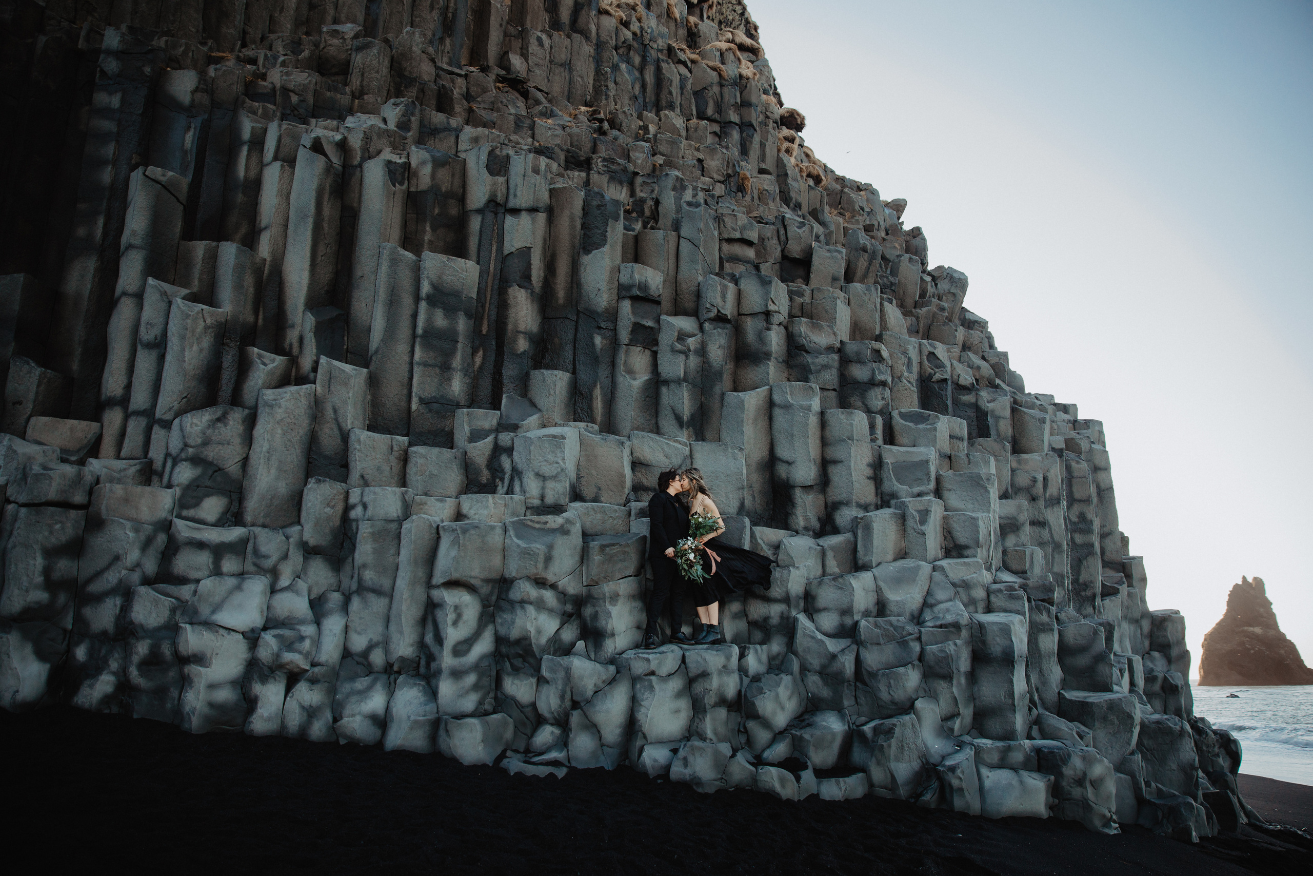Sunrise elopement at black sand beach in Iceland. Iceland elopement photographer & videographer