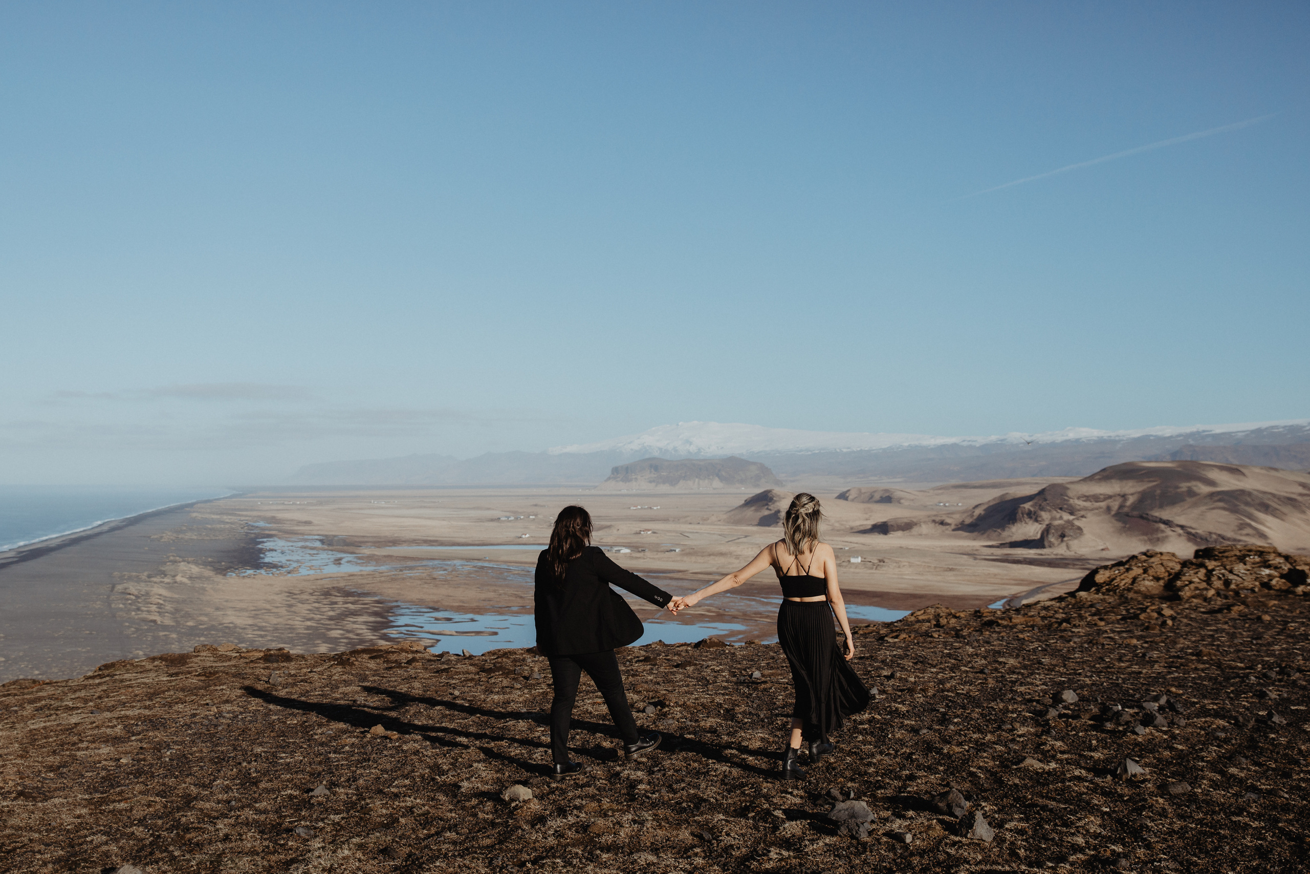 Sunrise elopement at black sand beach in Iceland. Iceland elopement photographer & videographer