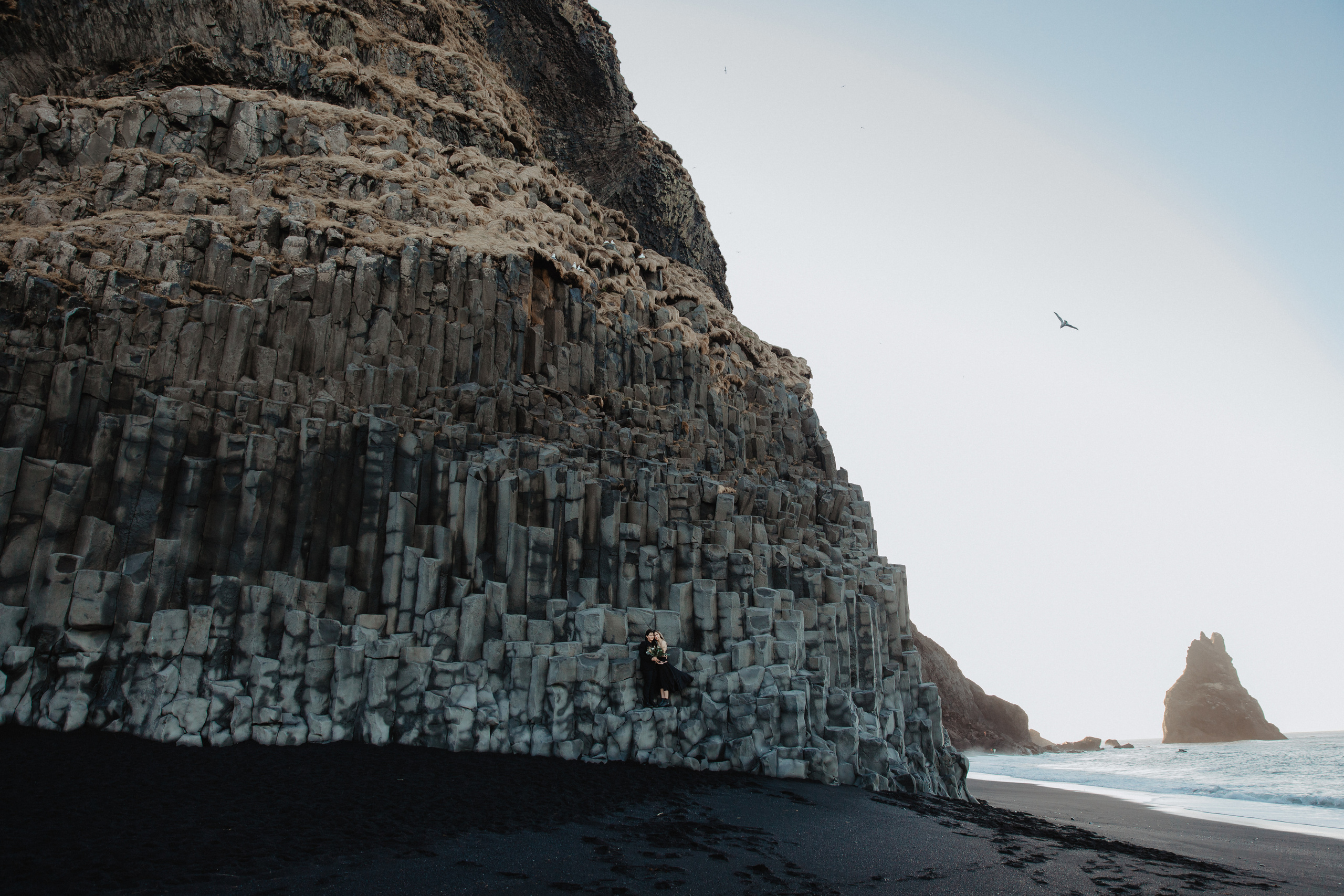 Sunrise elopement at black sand beach in Iceland. Iceland elopement photographer & videographer