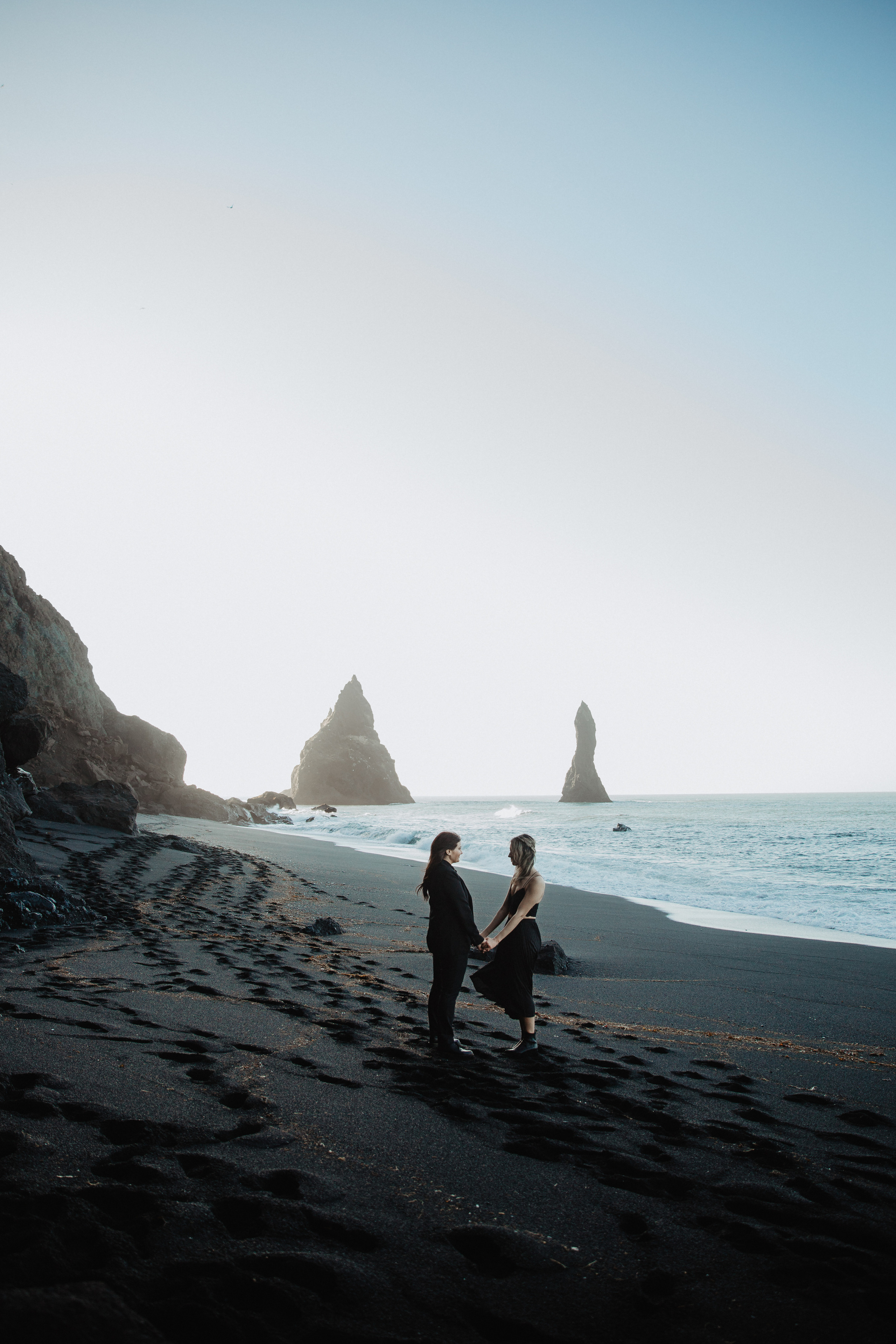 Sunrise elopement at black sand beach in Iceland. Iceland elopement photographer & videographer