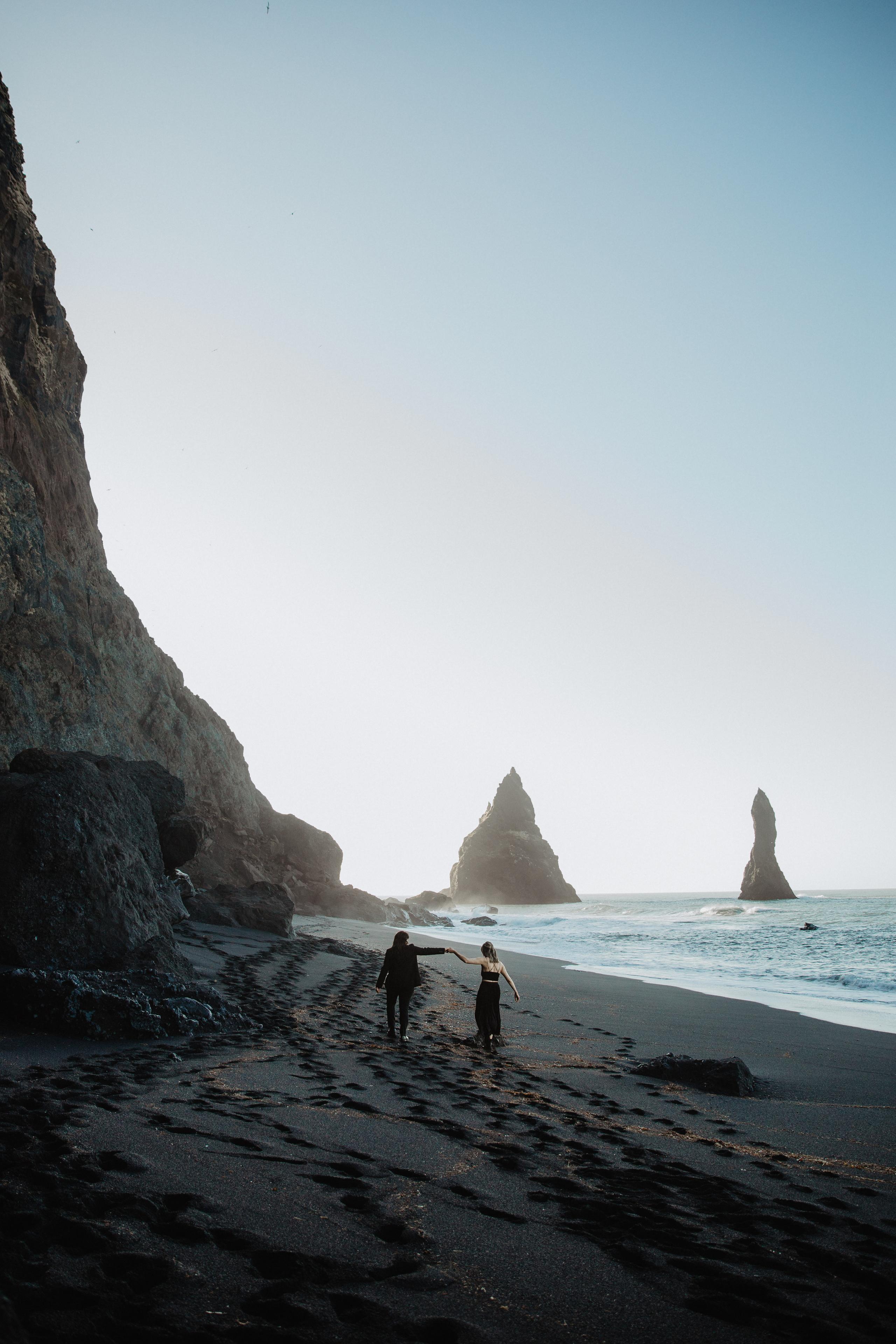 Sunrise elopement at black sand beach in Iceland. Iceland elopement photographer & videographer