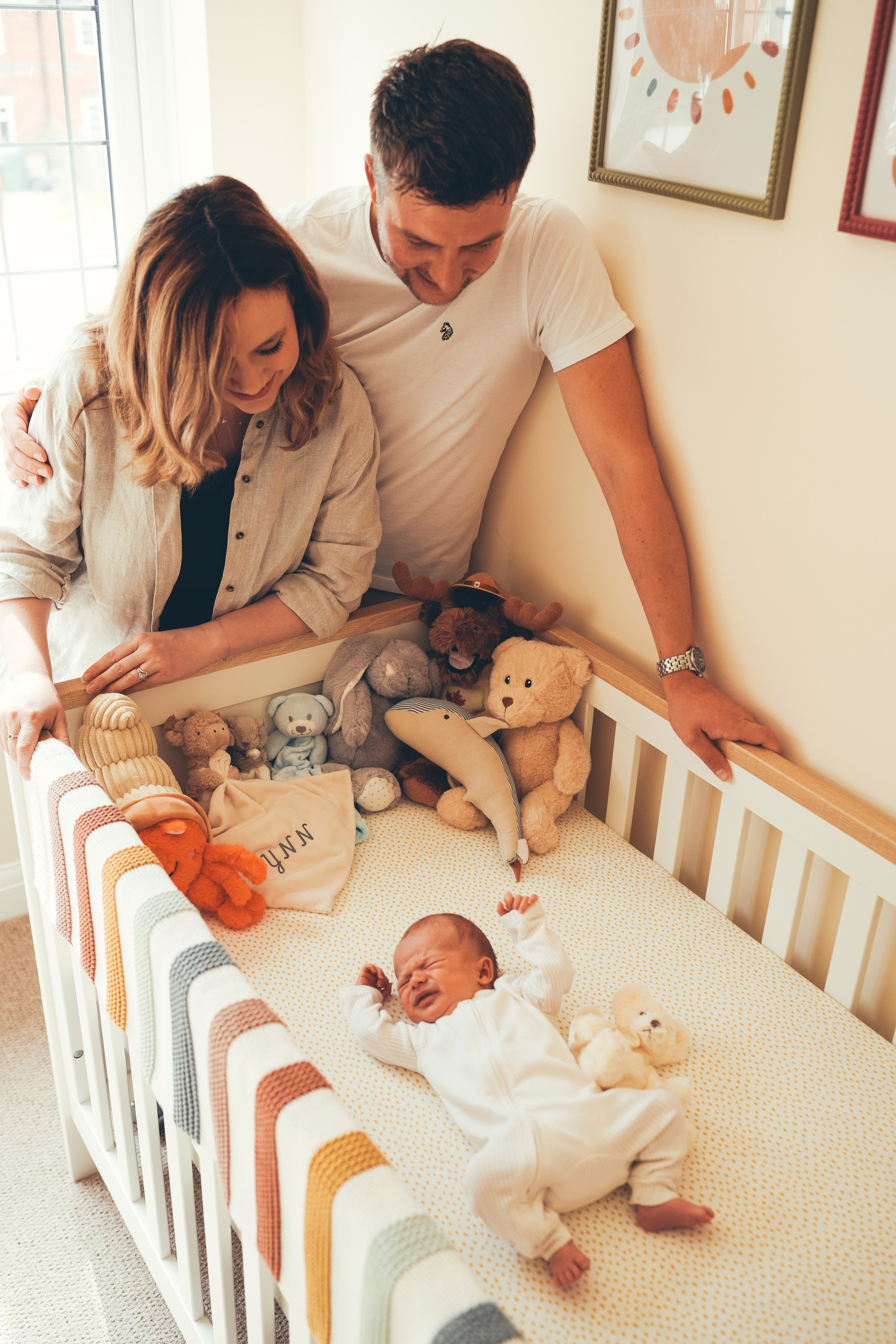 Patents looking at the newborn baby. Solihull photoshoot.