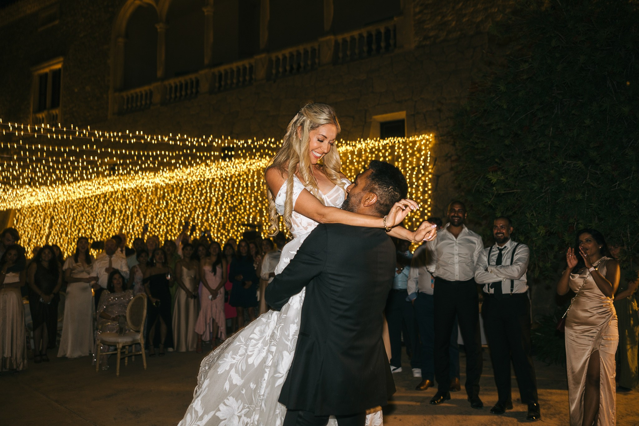 Groom lifting his bride during their first dance at their Mallorca wedding reception