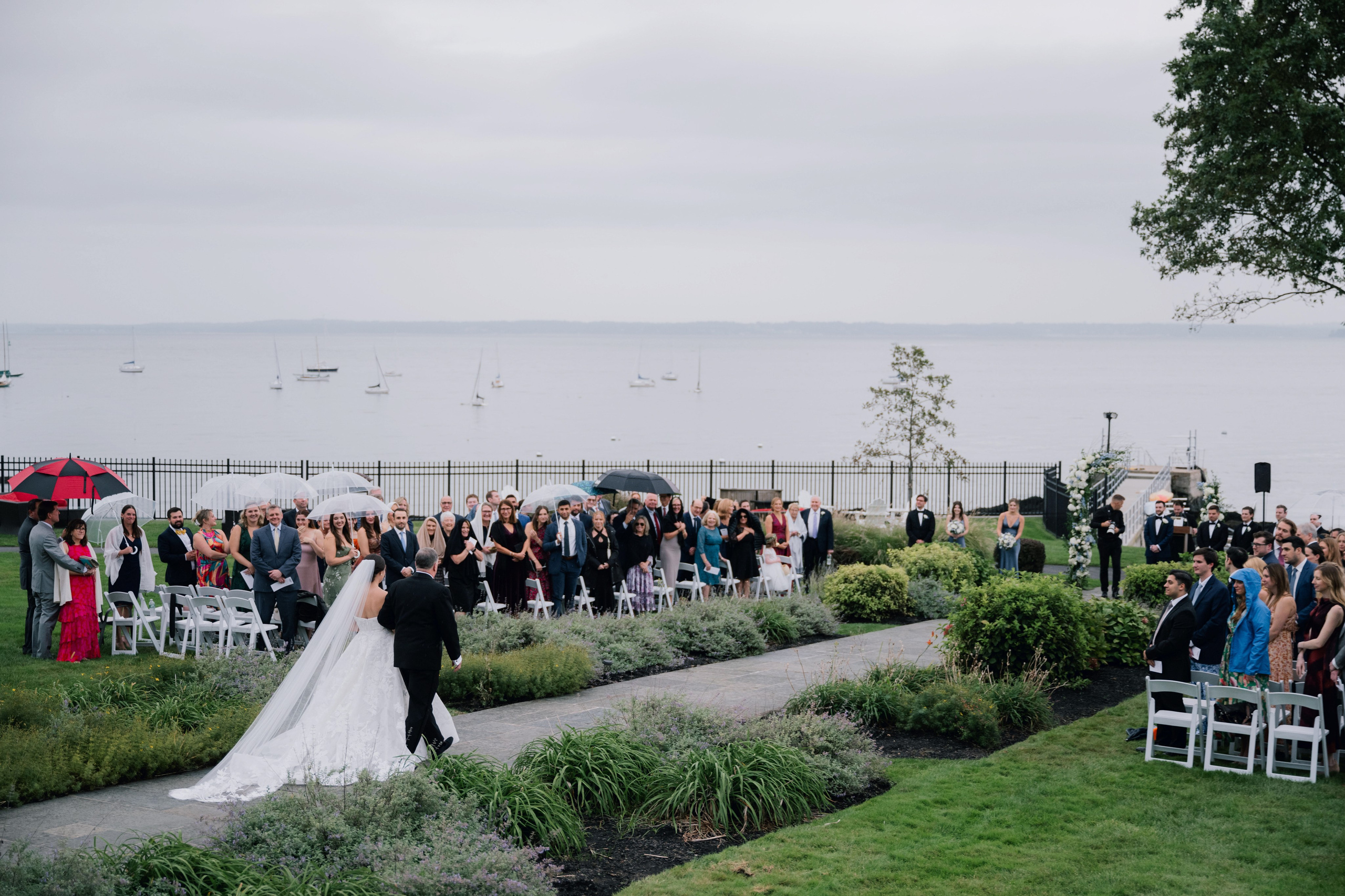 a bride and groom walking down the aisle