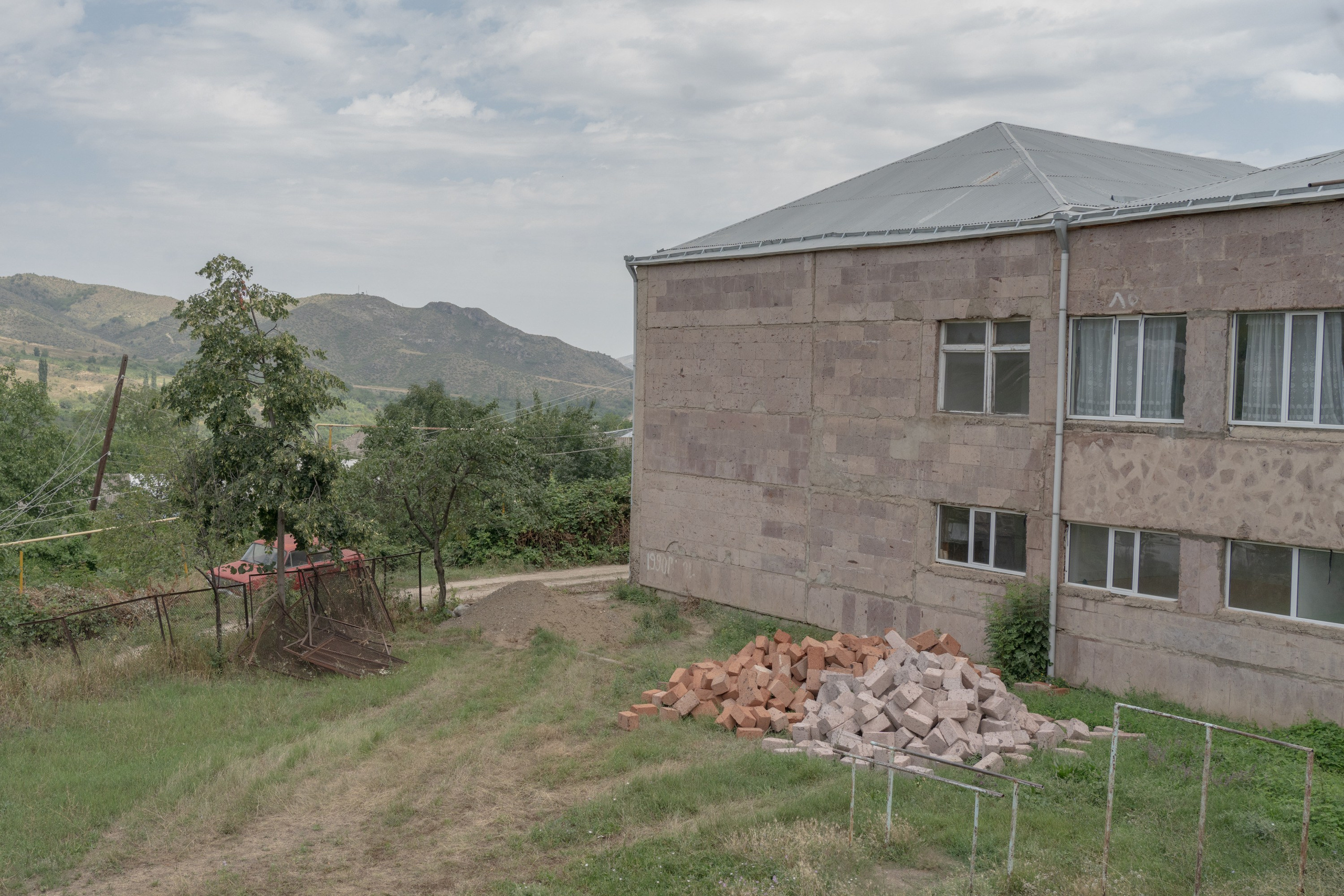 After the 2020 Nagorno-Karabakh war, some schools located close to the border with Azerbaijan are building walls for protection from possible cross-border shootings. This school in Tavush Province was preparing to build such a wall in summer so it could be ready by the school year.