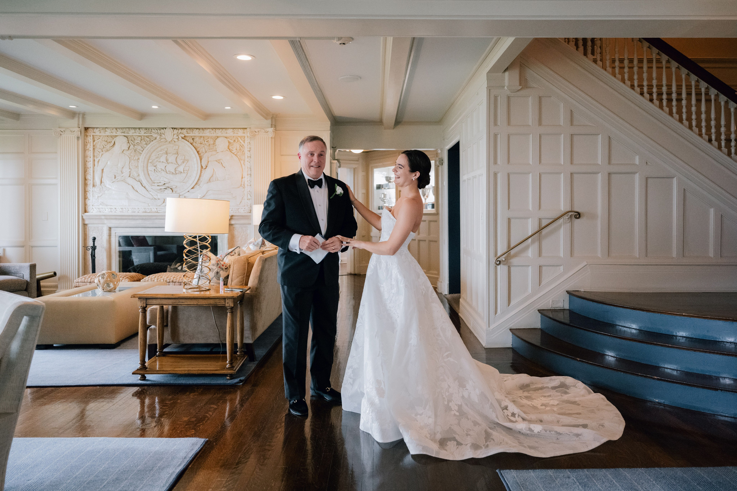 a bride and groom standing in a living room