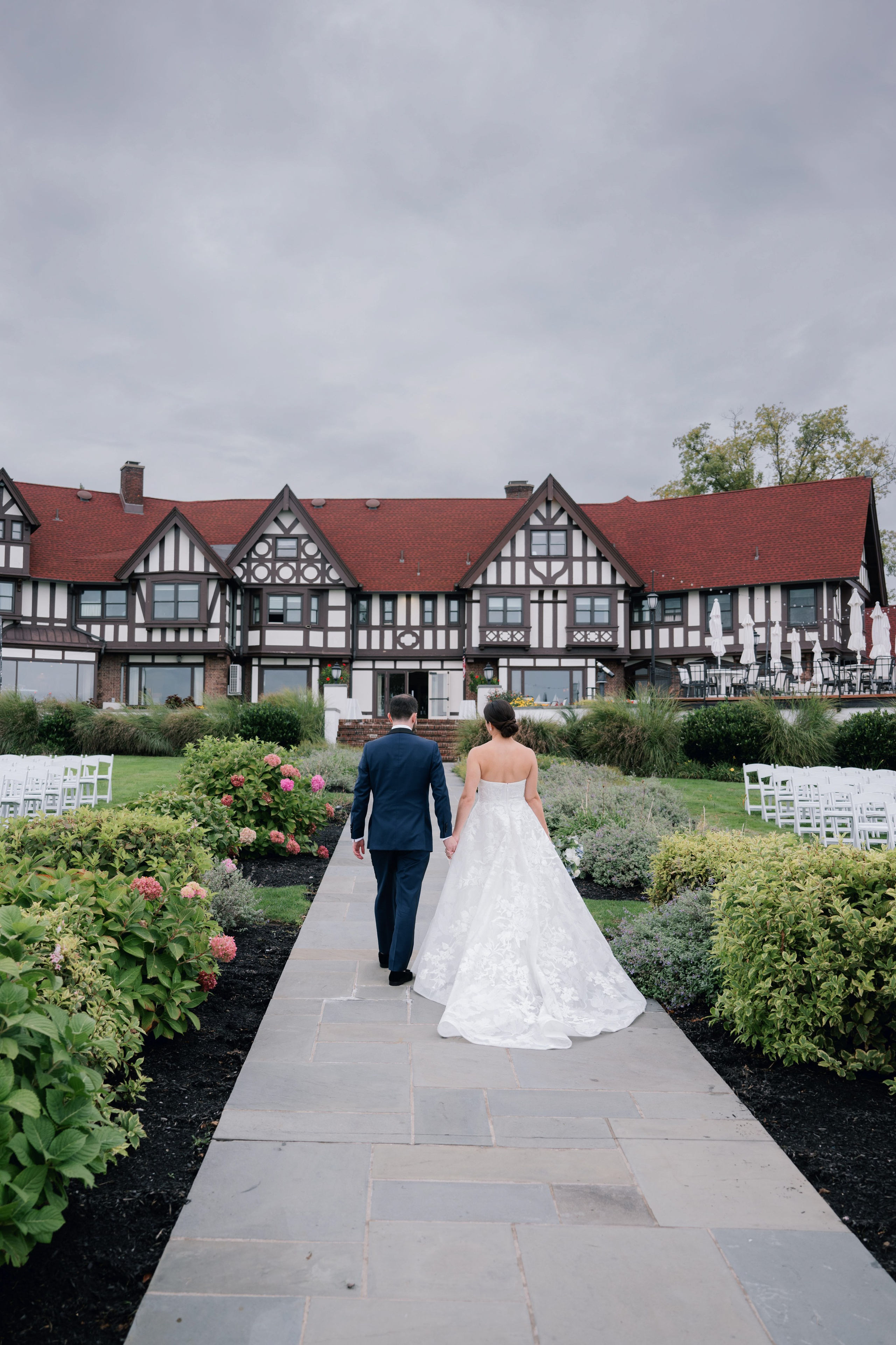a bride and groom walking down the aisle
