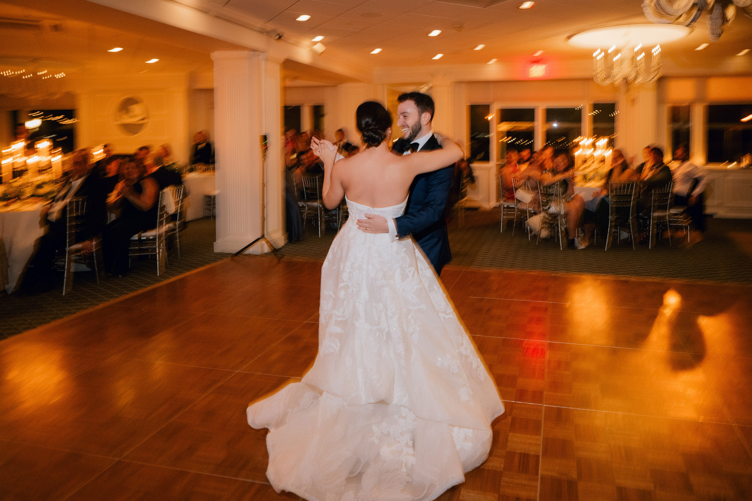 a bride and groom dancing at a wedding reception