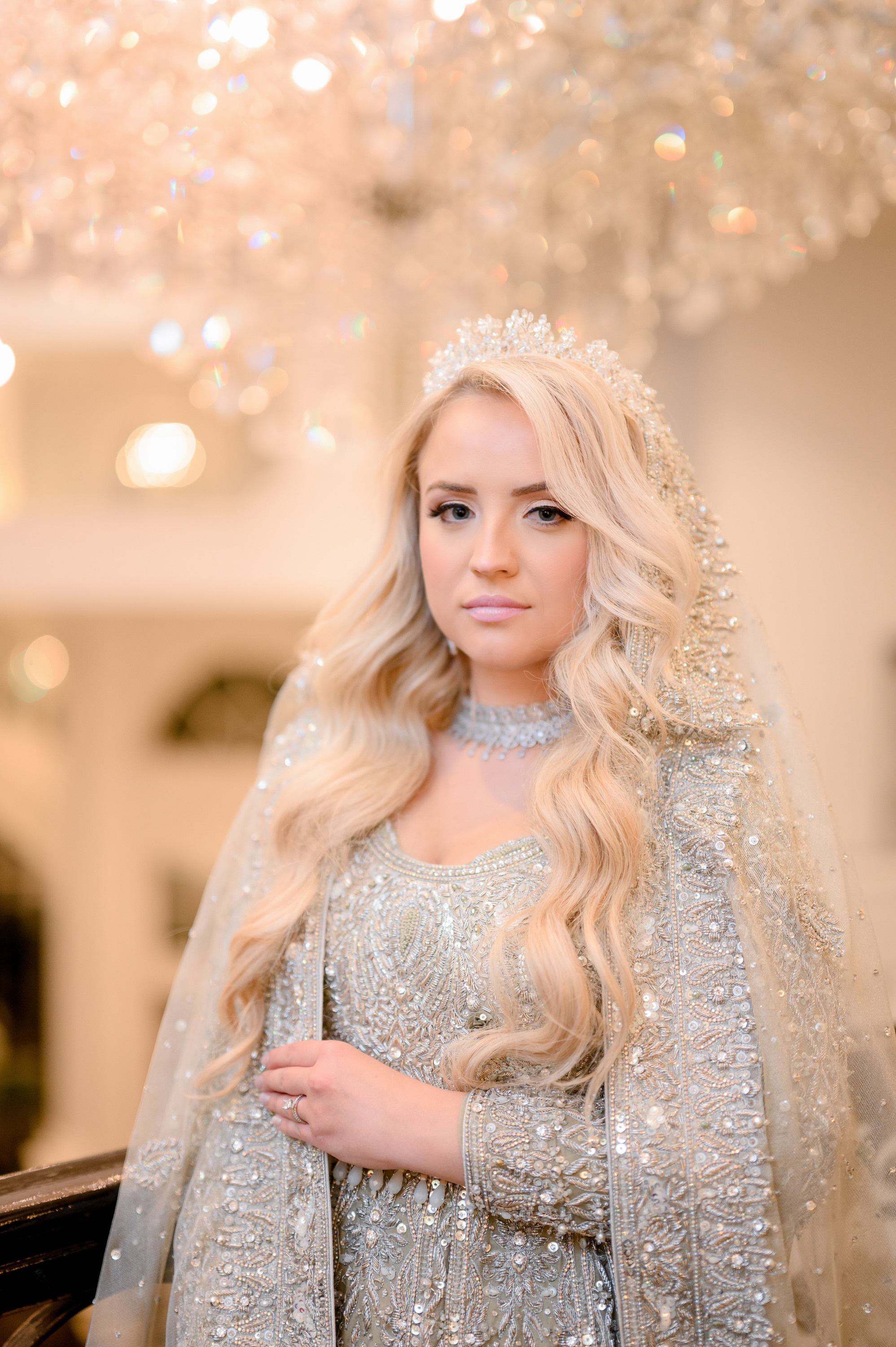 a woman in a silver dress and veil