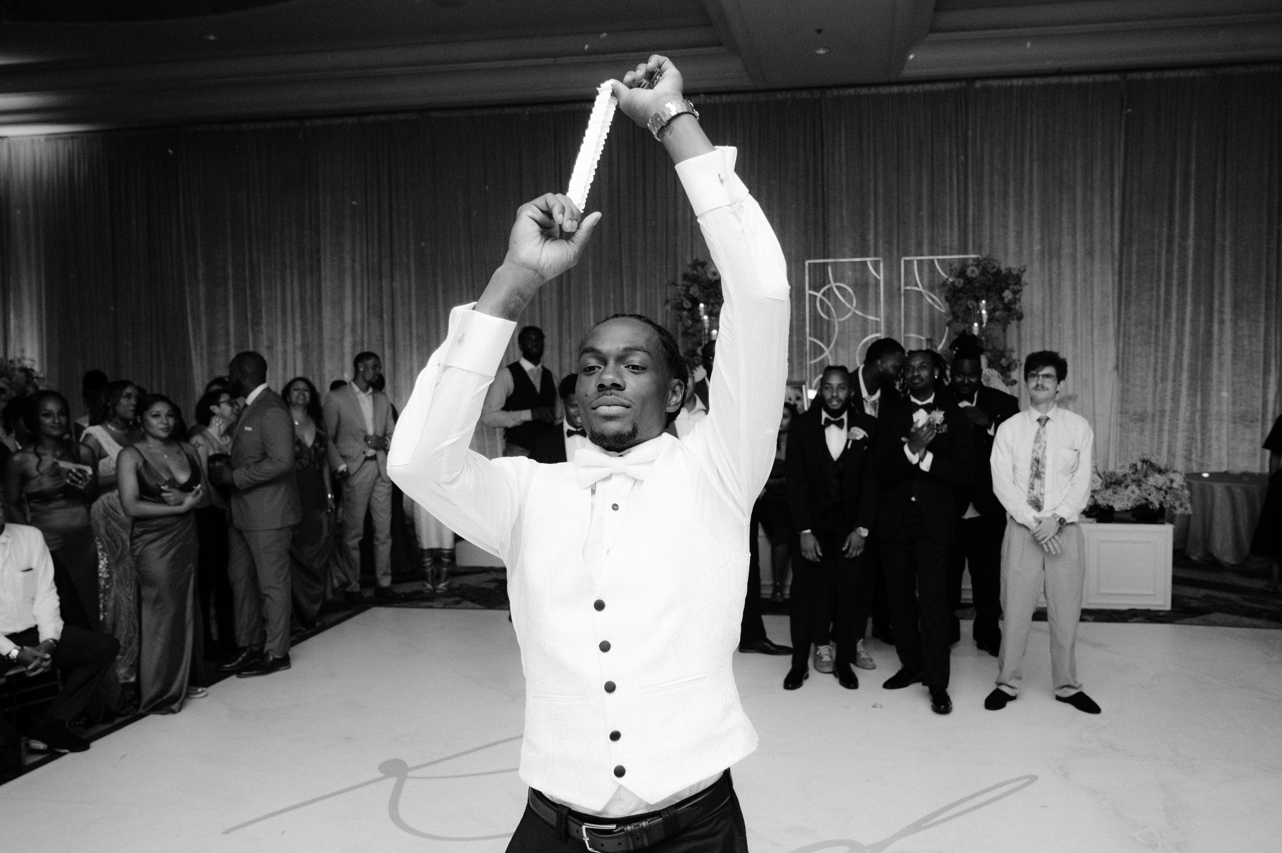 a man in a tuxed suit dancing