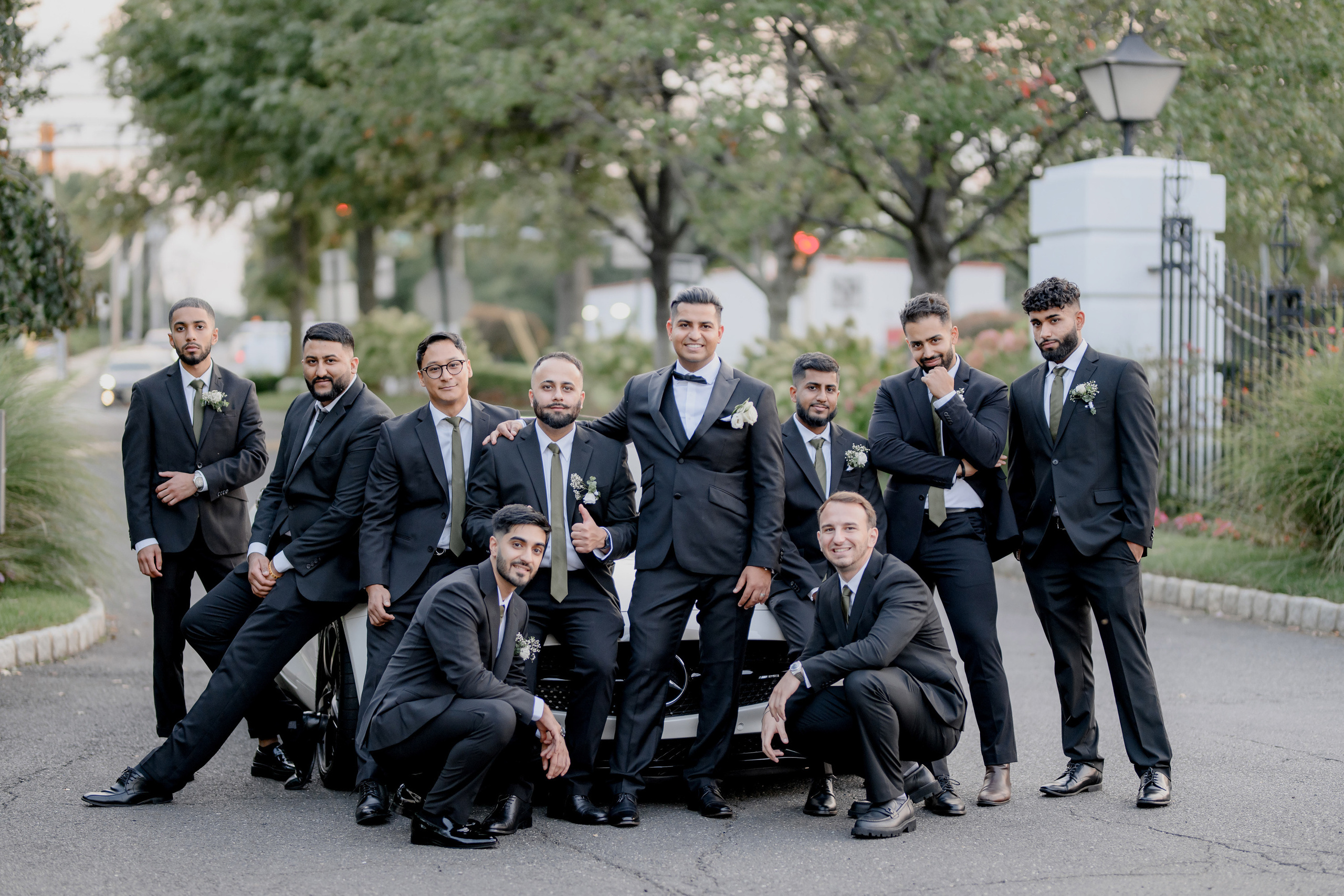 a group of men in suits posing for a picture