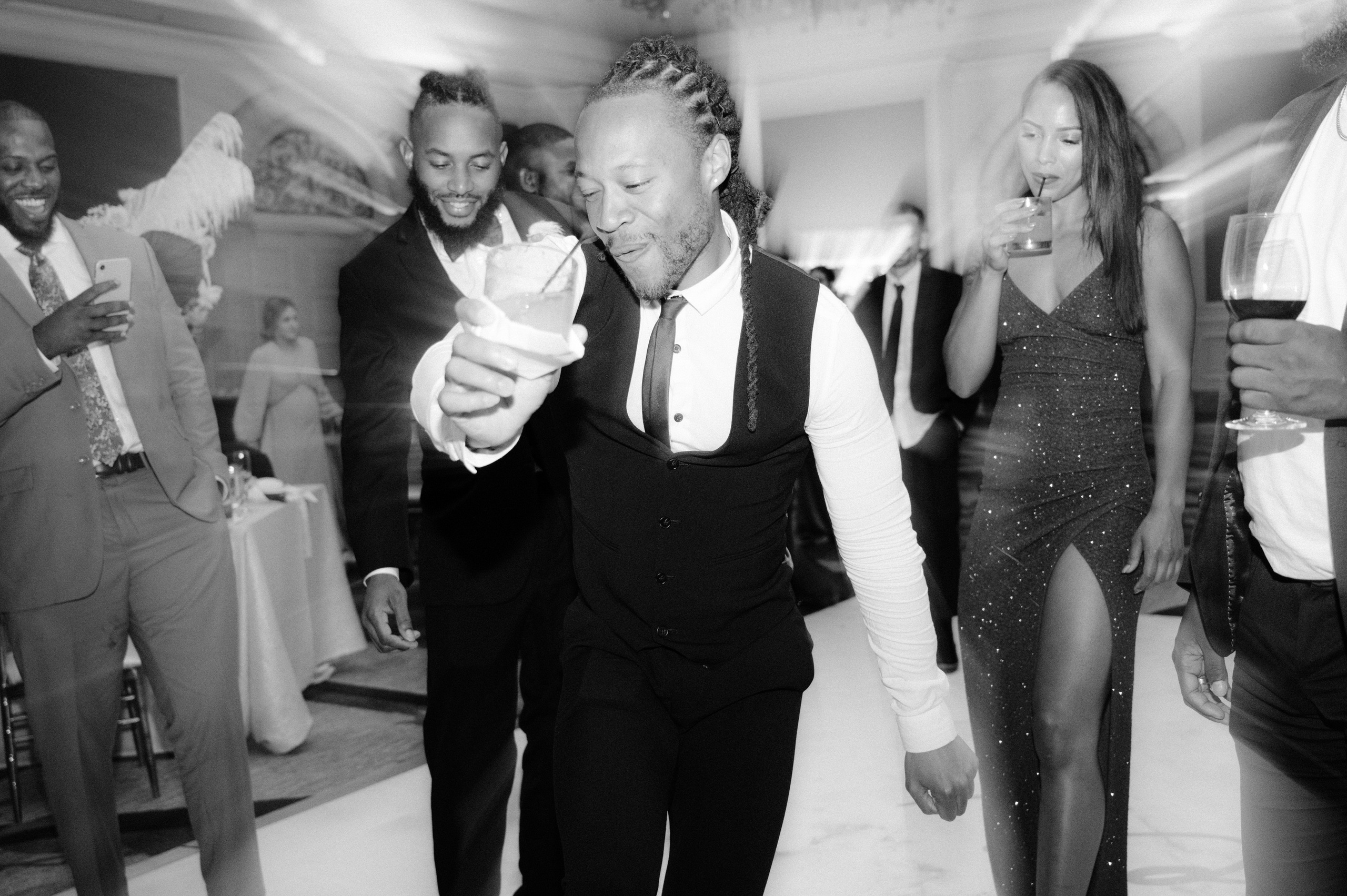 a man in a suit and tie is dancing