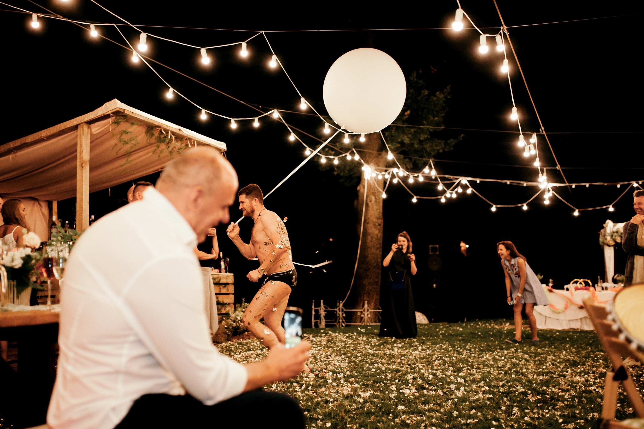 a man and woman dancing in a field
