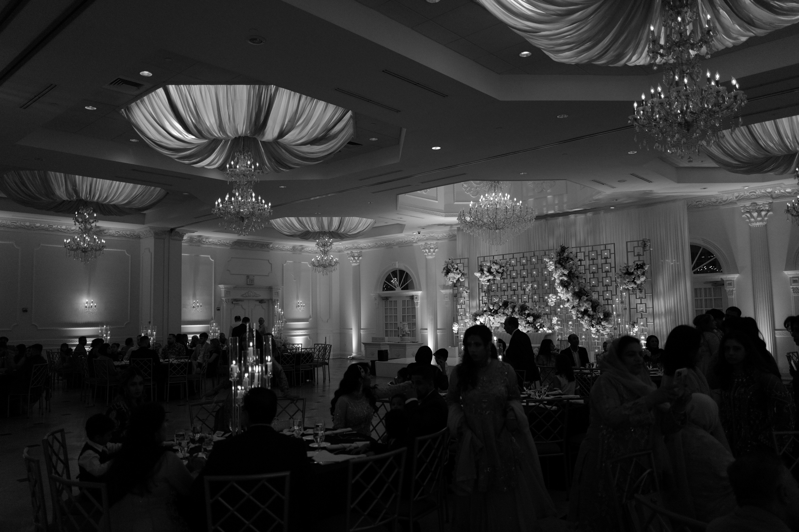 a black and white photo of a wedding reception