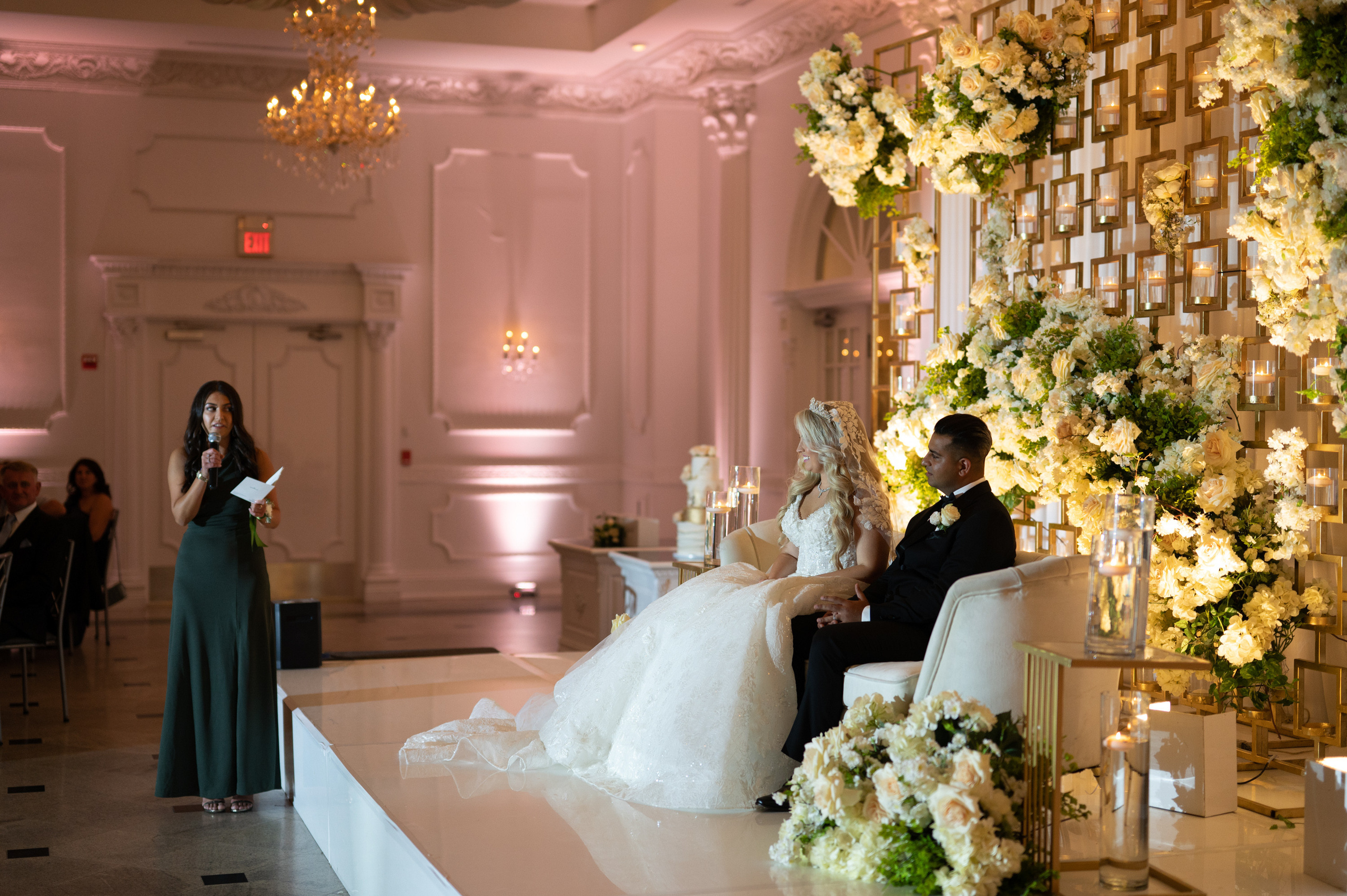a bride and groom sitting on a white table