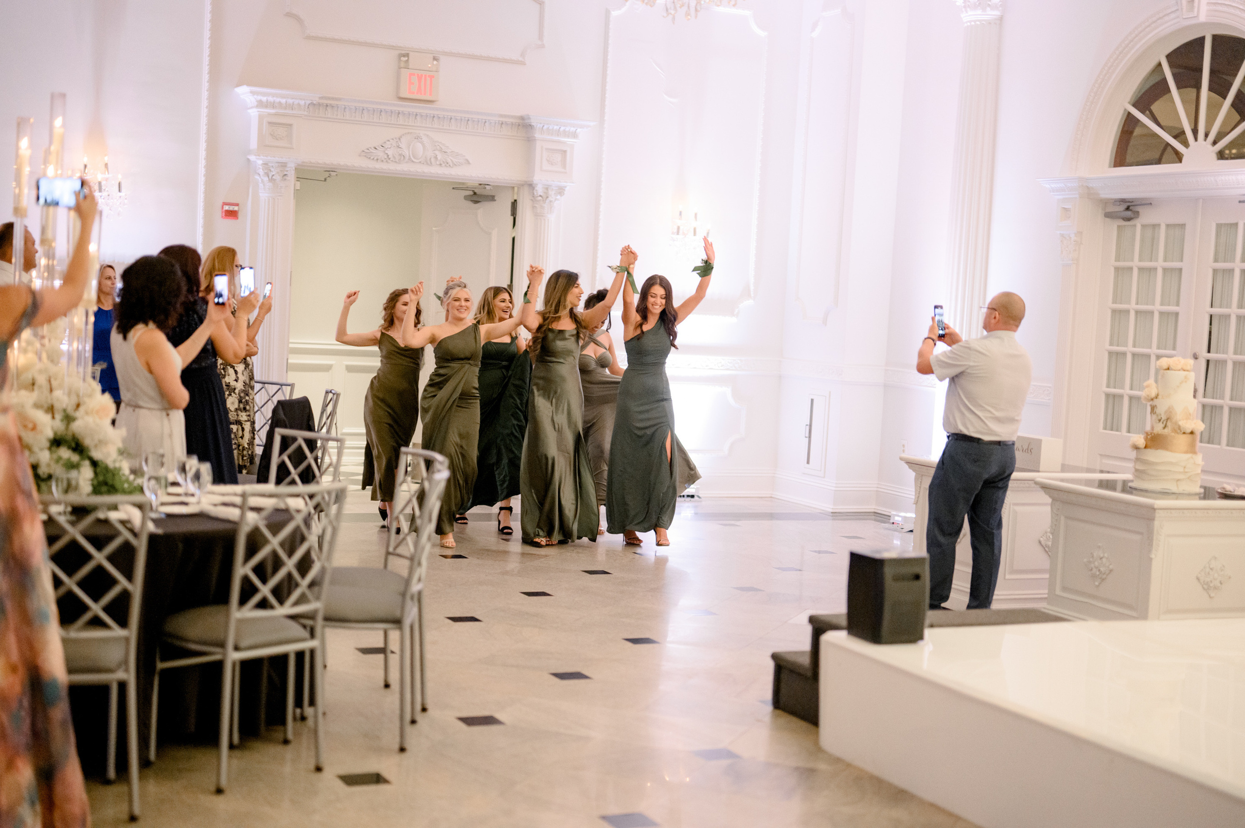 a group of people standing around a table