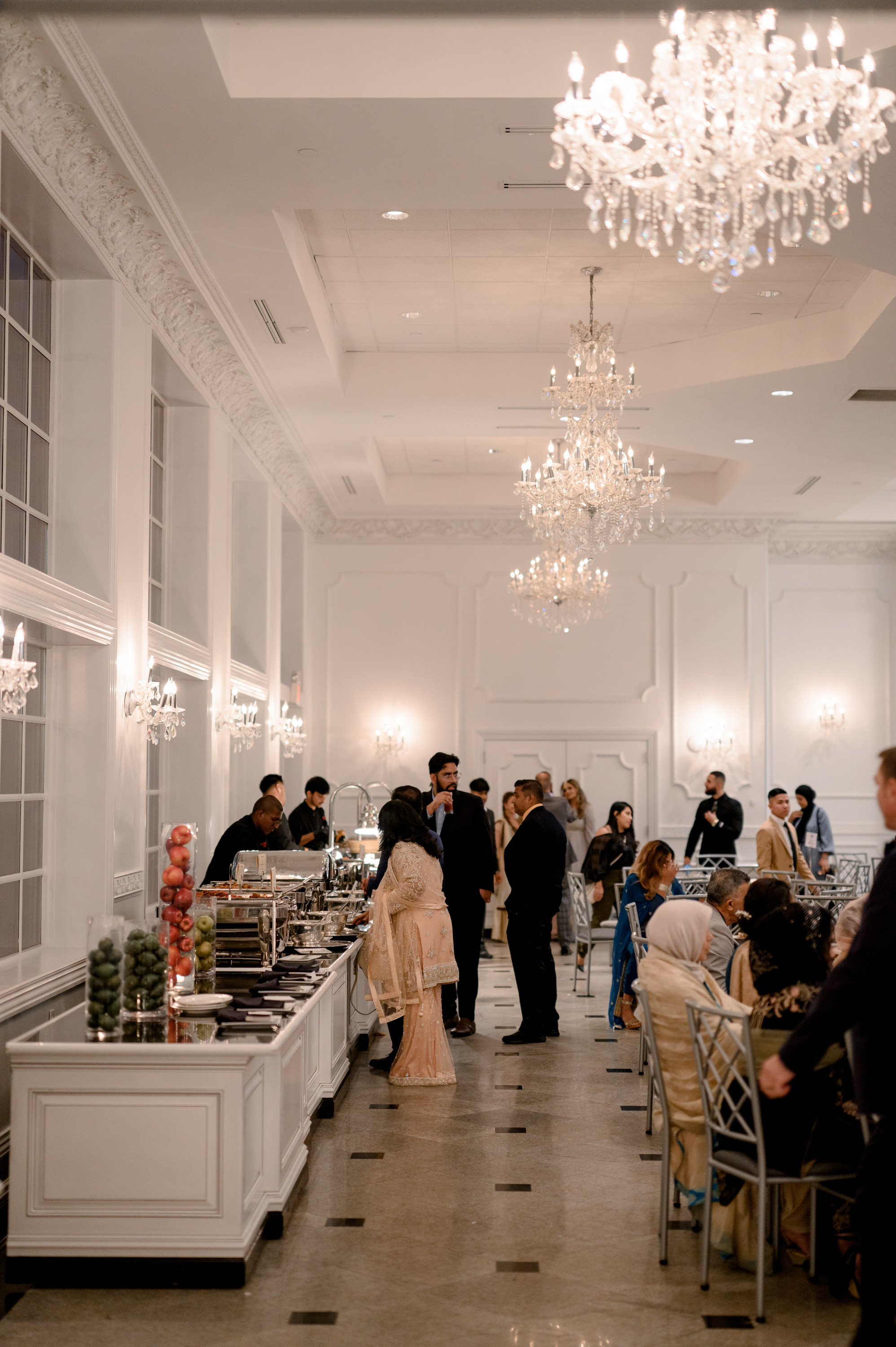 a group of people are eating in a restaurant