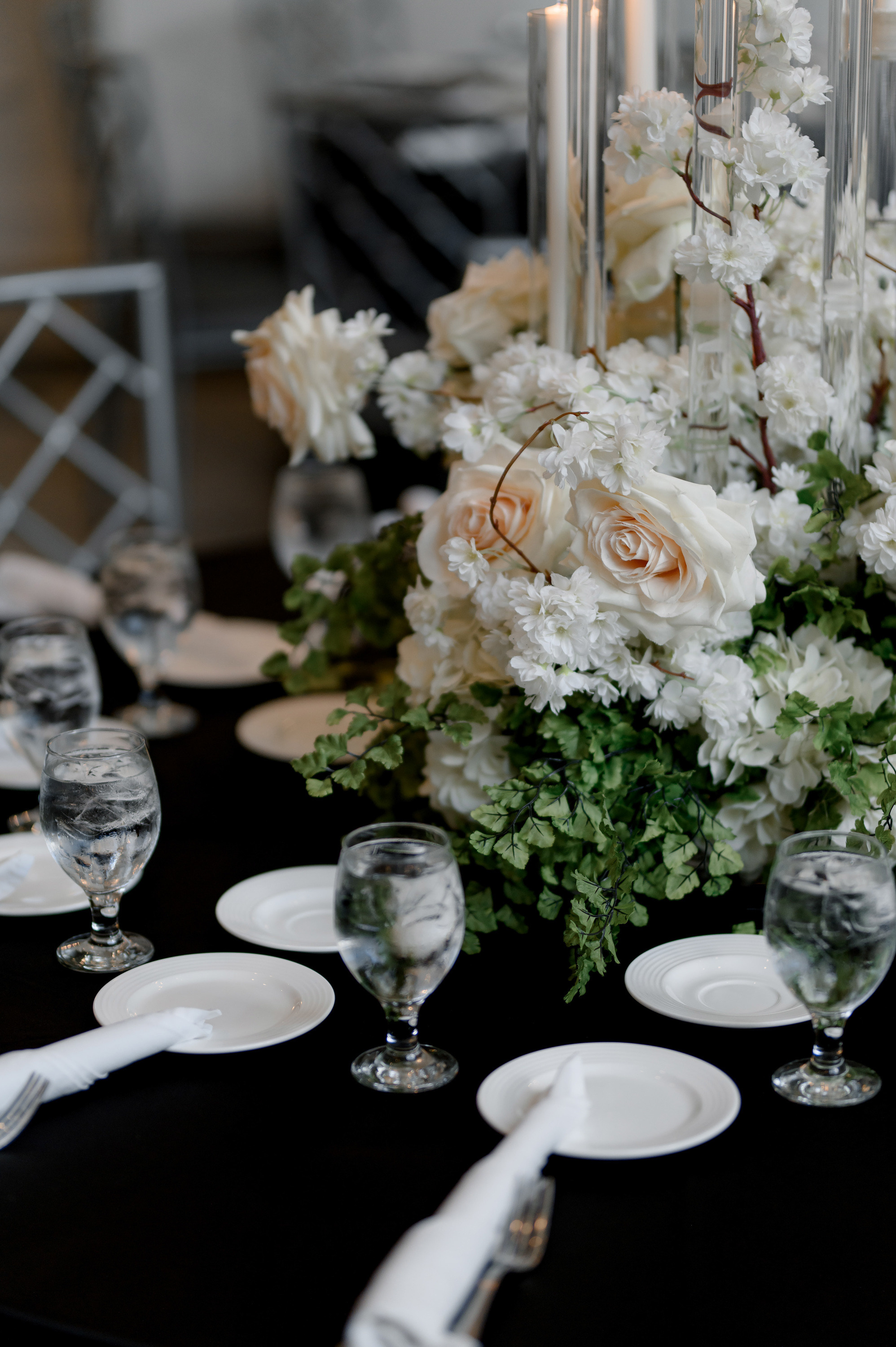 a table with a bunch of flowers and candles