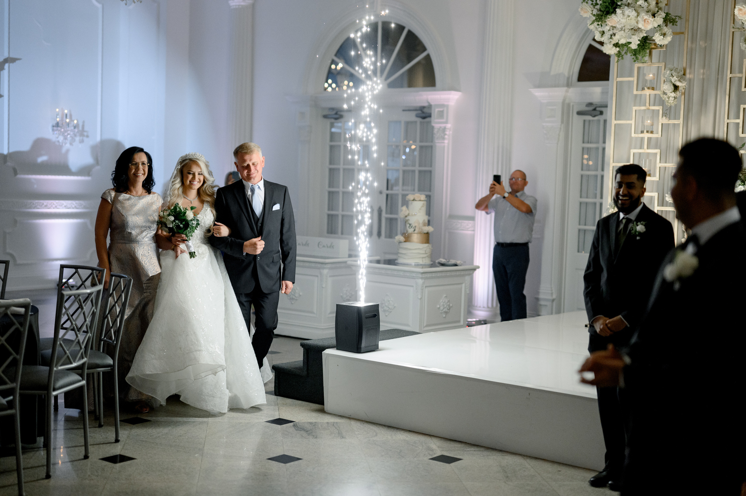 a bride and groom walking down the aisle