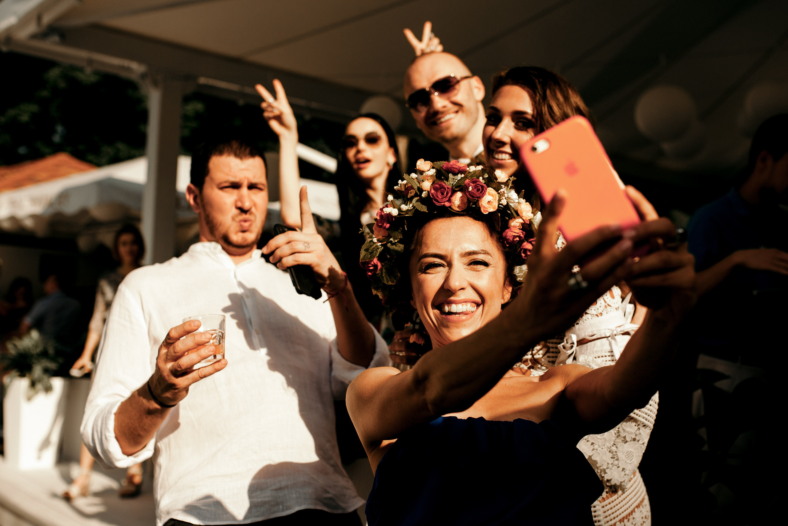 a group of people taking pictures of a bride