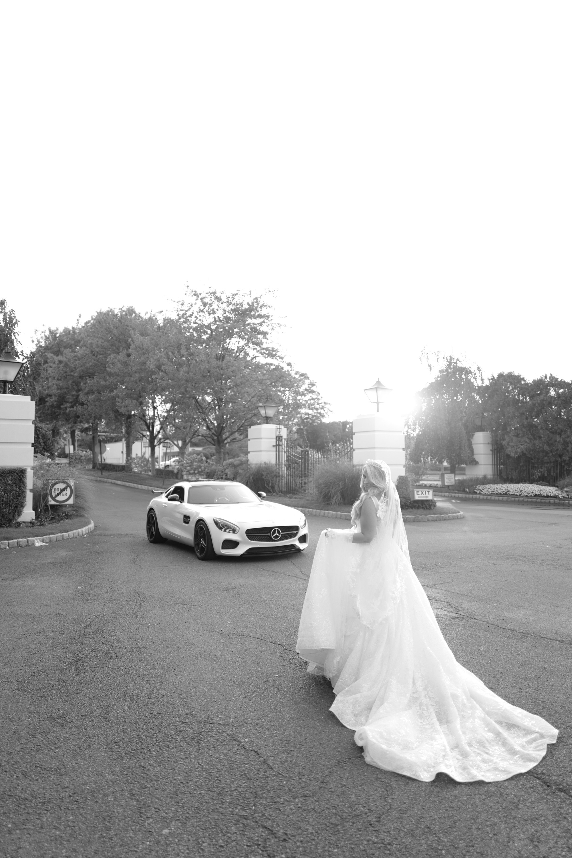 a bride walking down the street with her car