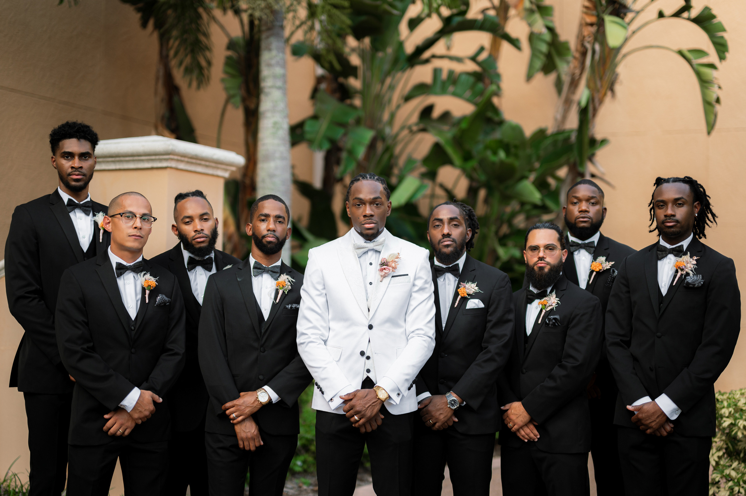 a group of men in tuxed suits