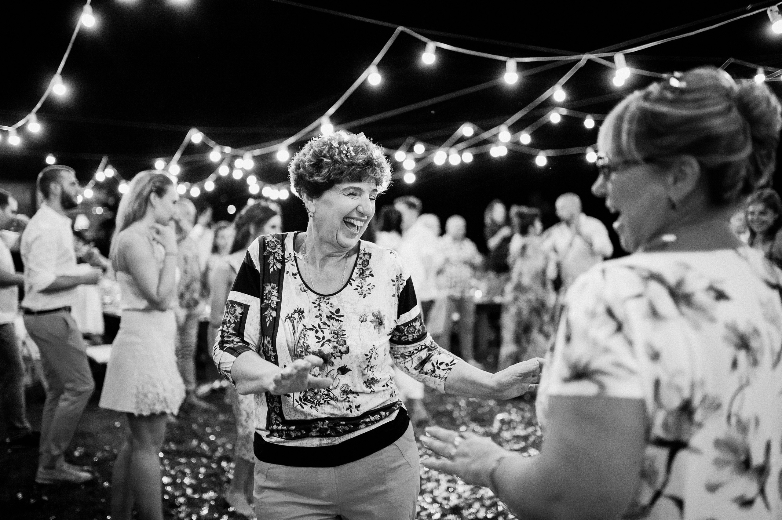a woman dancing at a wedding