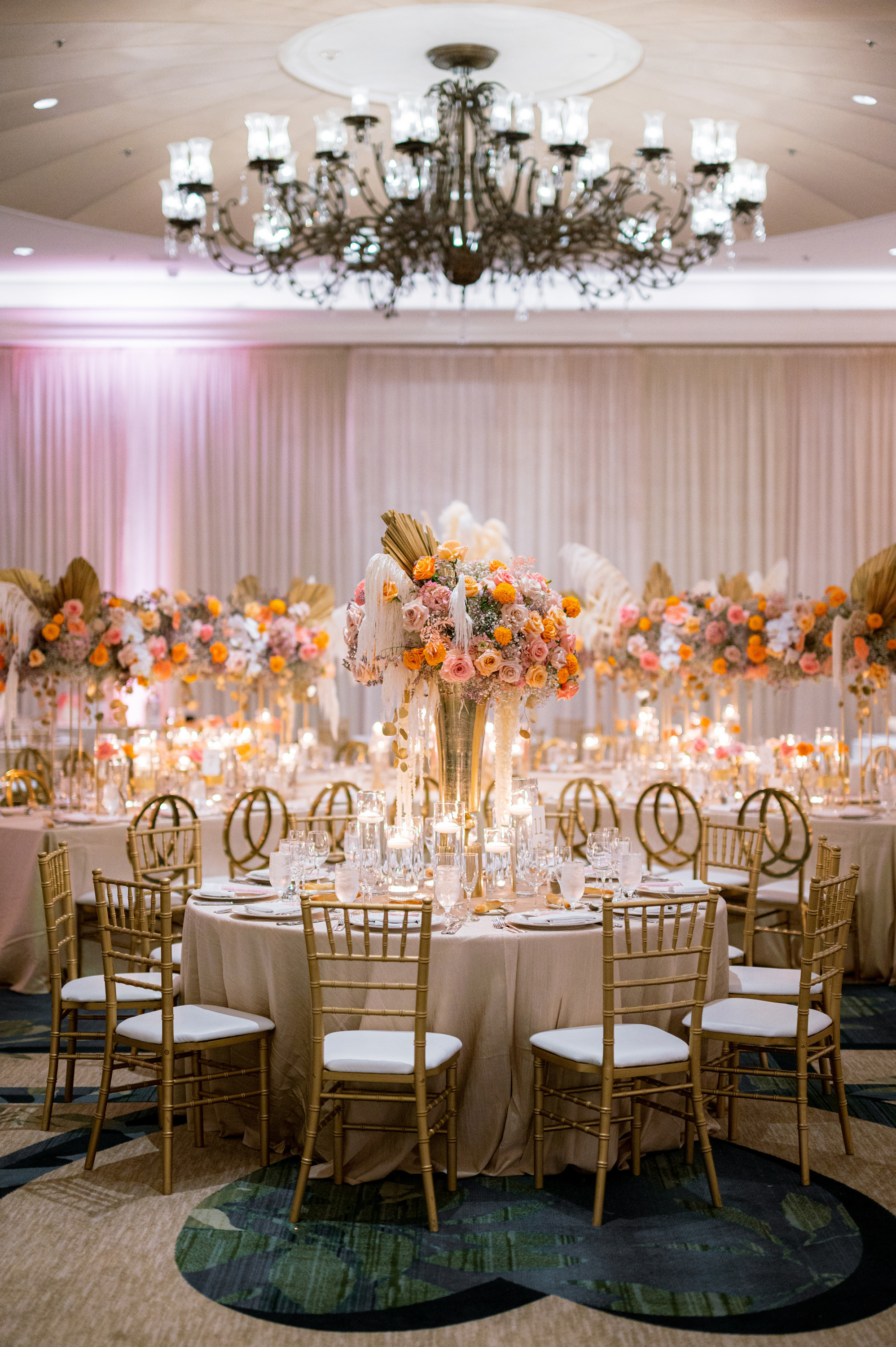 a table with a bunch of flowers and candles