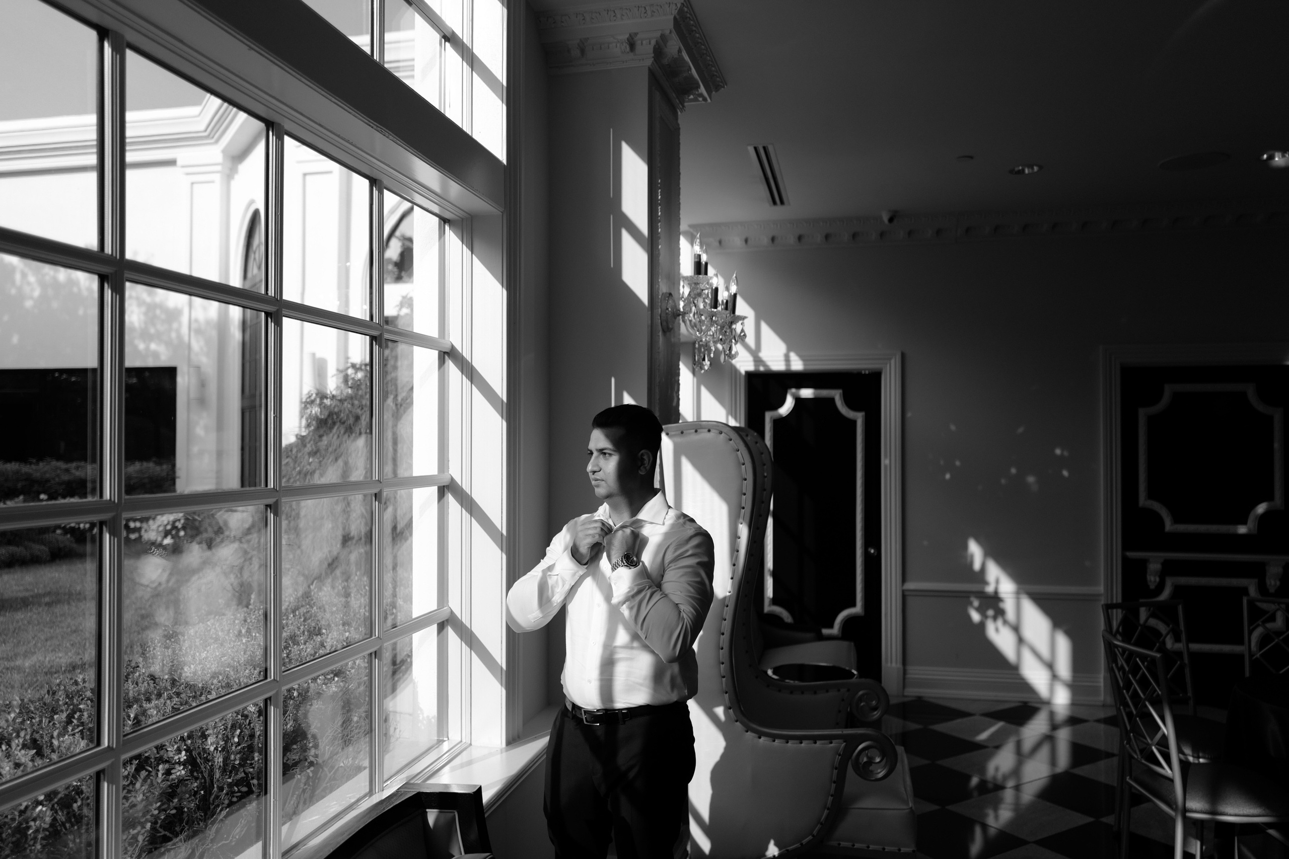 a woman standing in front of a window