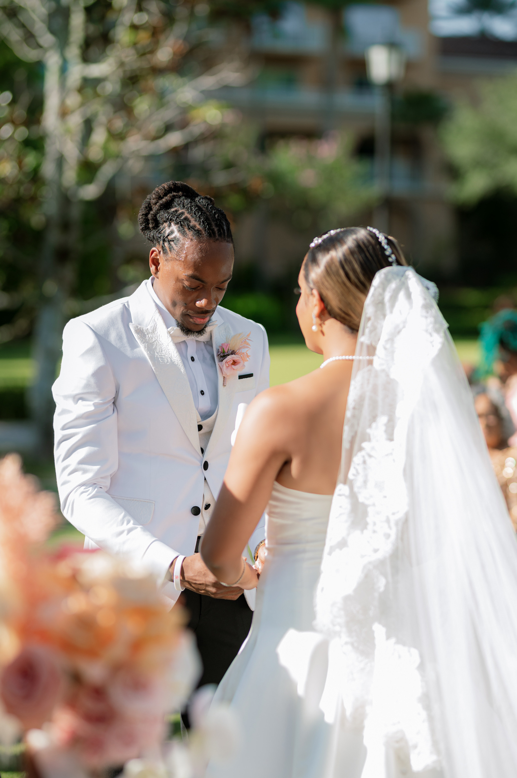 a bride and groom exchanging during their wedding ceremony