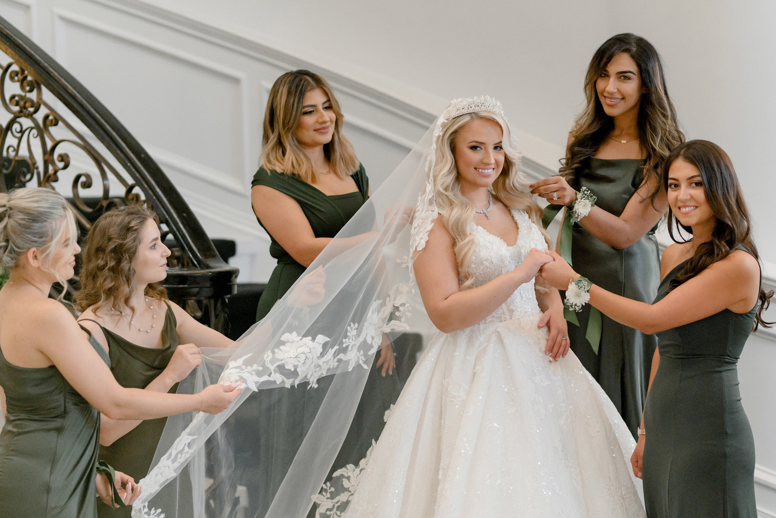 a bride is getting ready to get into her wedding dress